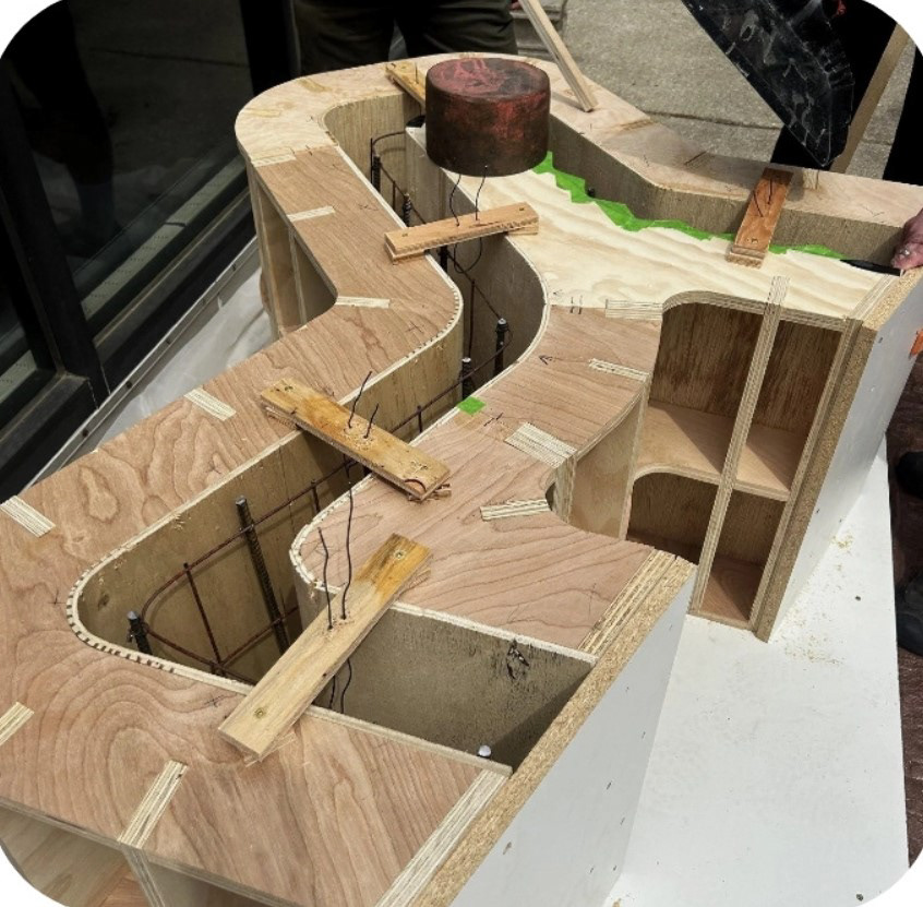Concrete chair: CNC wooden mold and barb wire interior support.