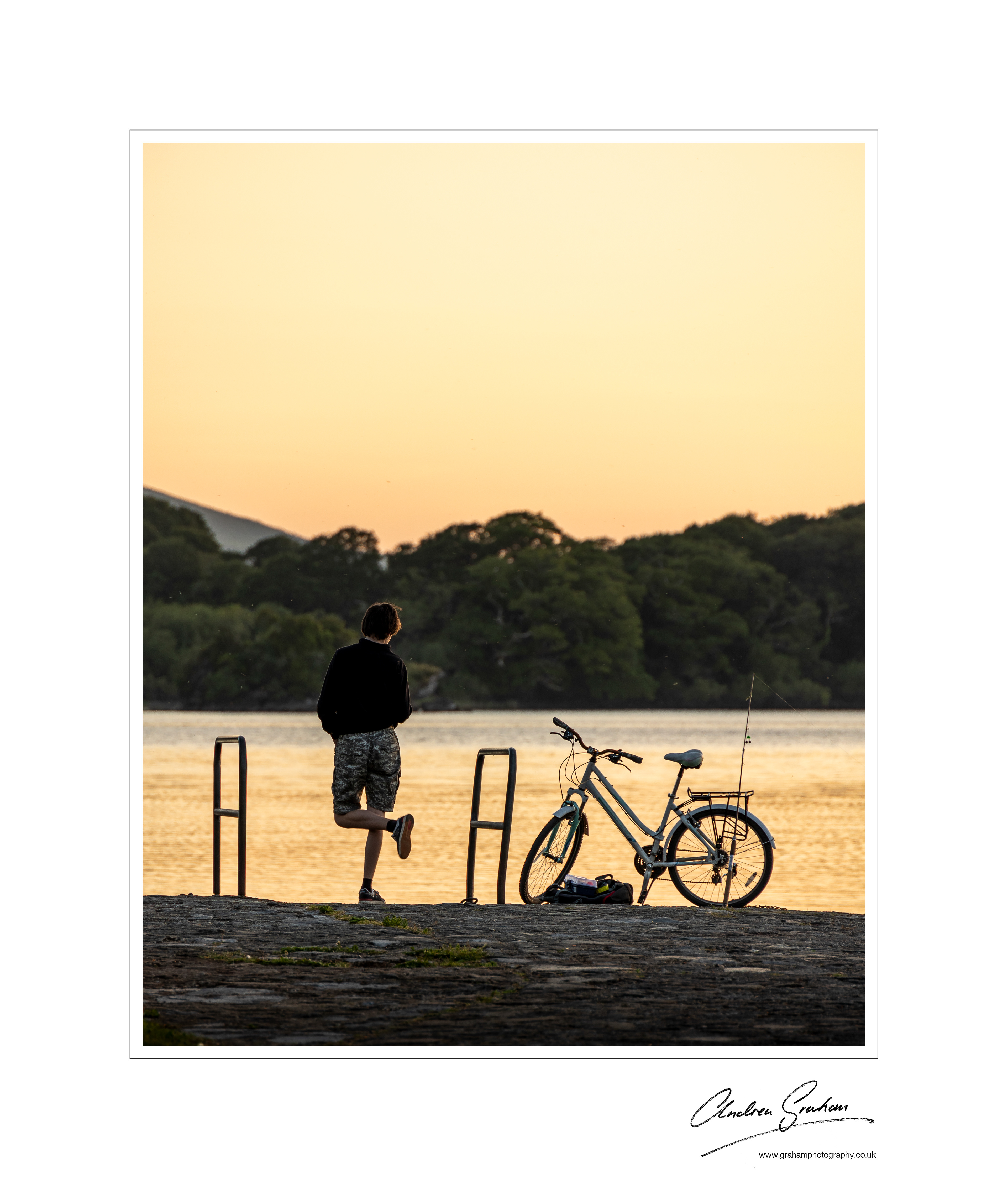 Boy with bike at sunset near Killarney