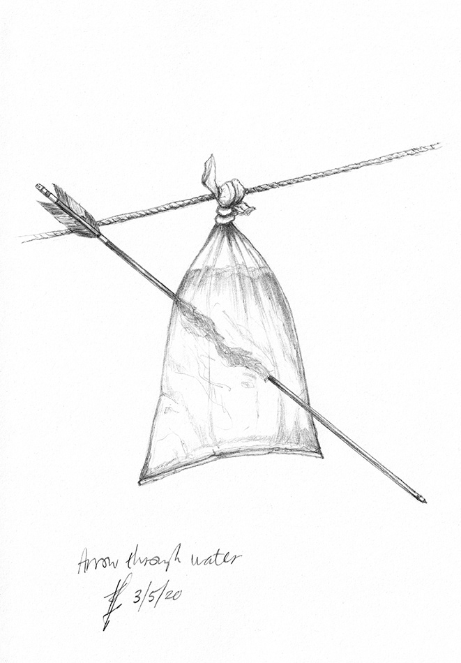 japanese arrow shot through a hanging bag of water
