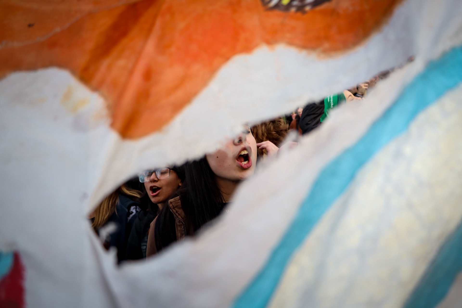 Demonstrators take part in a feminist protest marking the Not One (women) Less movement outside the National Congress | Buenos Aires, 2024.