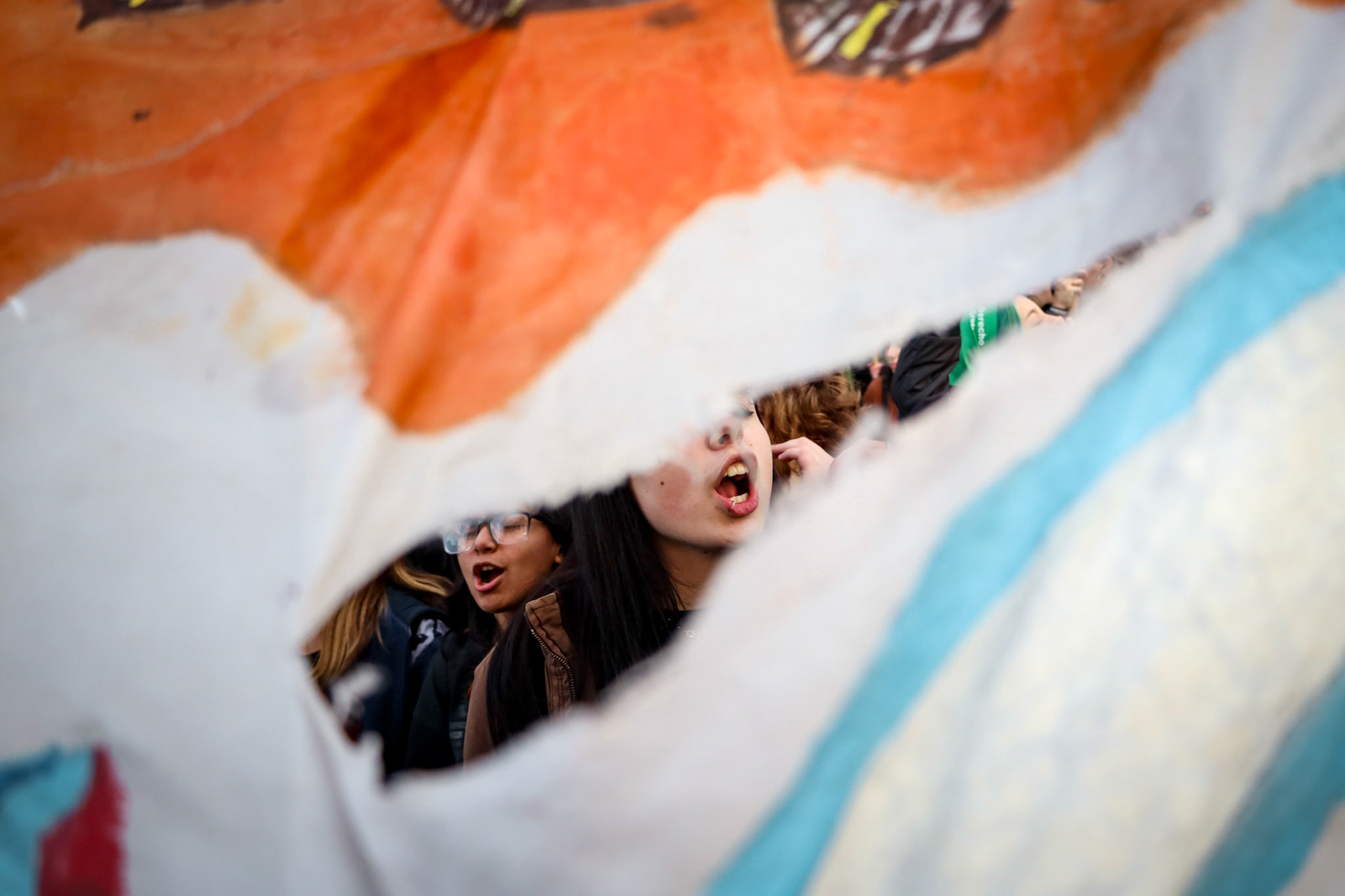 Demonstrators take part in a feminist protest marking the Not One (women) Less movement outside the National Congress | Buenos Aires, 2024.