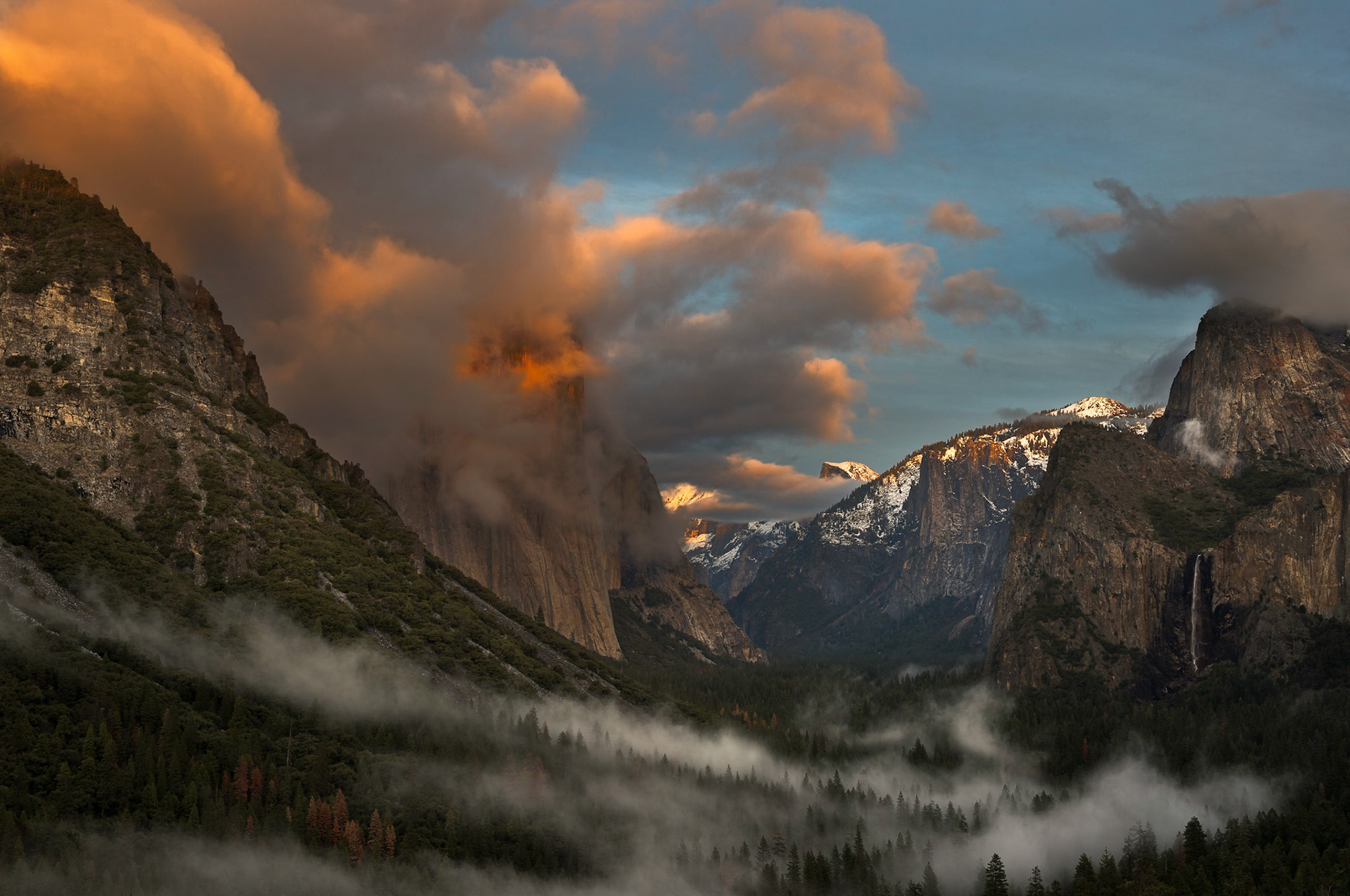 Winter sunset from classic Tunnel View (aka Discovery View), Yosemite National Park. We lucked out with some pretty interesting cloud and low hanging fog formations on this particular evening!   Thank you for viewing, voting and/or any constructive comments!