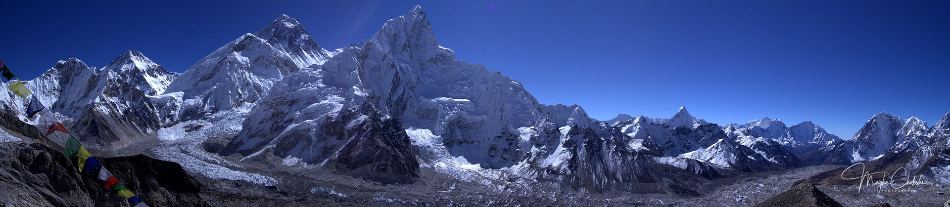 Panorama of Everest and surrounding named and unnamed peaks from Kala Patthar (18,600). Nuptse (25,801), Khumbutse (21,772), Everest (29,029), Lhotse (27,940), Ama Dablam (22,349), Thamserku (21,729), and Kangtega (22,251). 