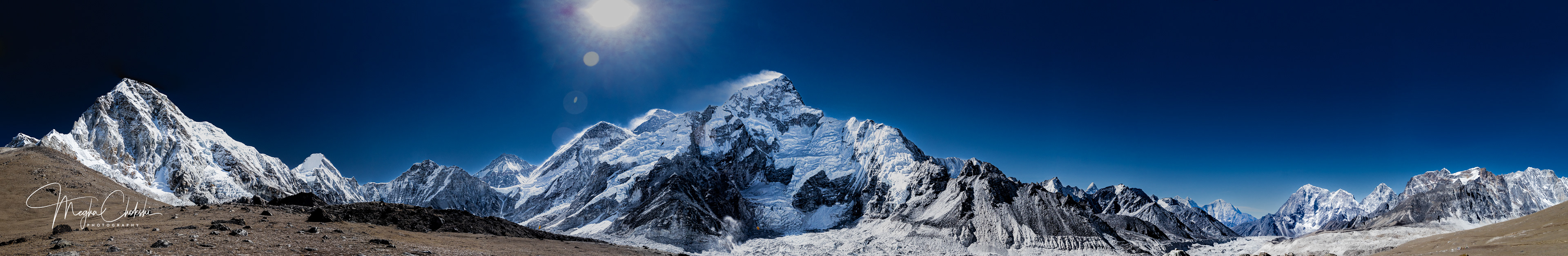  almost 350-degree view of Everest and surrounding named and unnamed peaks. Pumori (23,494), Lingtren (22,142), Nuptse (25,801), Khumbutse (21,772), Everest (29,029), Lhotse (27,940), Ama Dablam (22,349), Thamserku (21,729), and Kangtega (22,251). This panoramic is from Kala Patthar(18,600), which is an outlier of Pumori as a small brown bump. The 2015 Everest avalanche that hit Everest Base Camp is said to have started between Pumori (far left) and Lingtren (peak next to it). You can see the Khumbu Icefall behind the dark brown bump as it edges its way into the Everest South Col. I had to step back a little bit to get an uninterrupted, sweeping view of this amazing landscape. I was standing at 18,600 ft, but the peaks loomed above me touching the skies. 