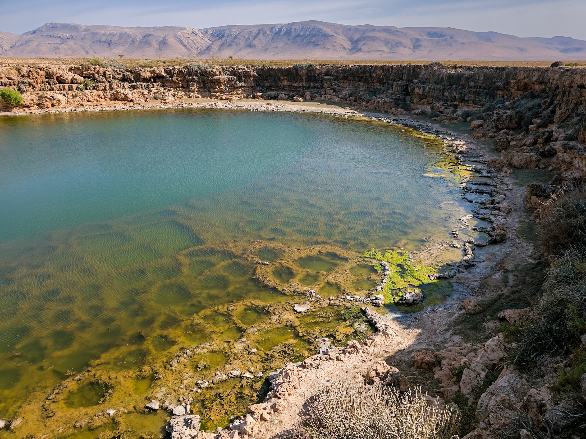 Salt pans in a sinkhole. During the rainy season, the sinkhole fills with salty water. Then, during the dry season, as the water level goes down, this water gets stagnant and evaporates, leaving behind the much needed salt cristals.