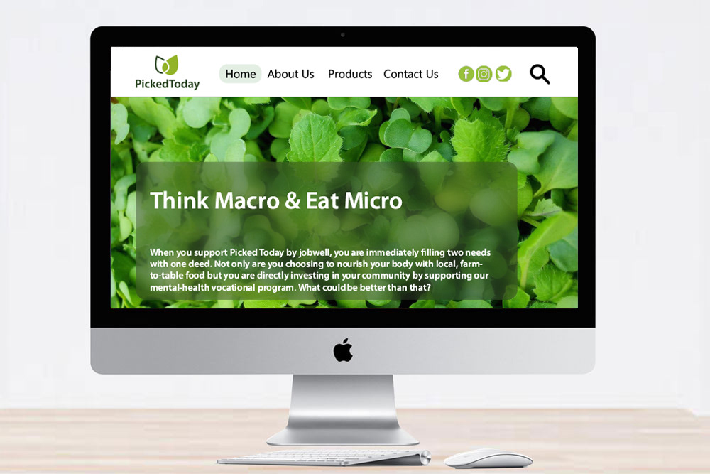 A mac desktop monitor displaying a mock-up of the Picked-Today Homepage