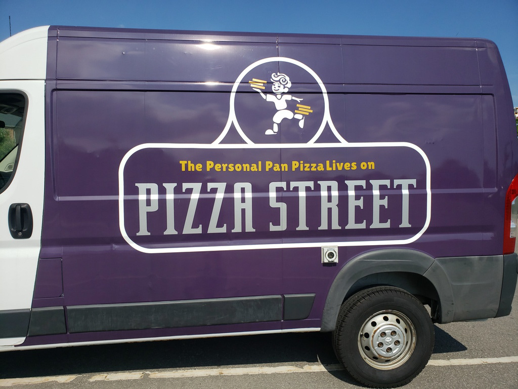 Side view of the Pizza Street truck with the logo fully visible