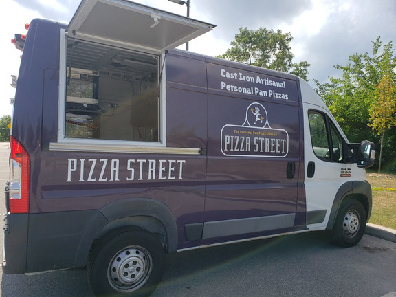 Side-view of the Pizza Street food truck with the service window open