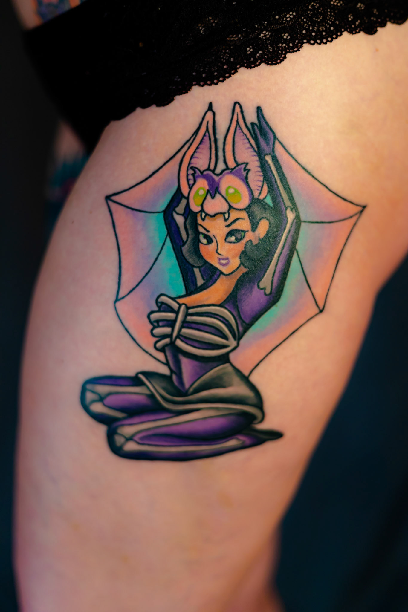 The bat pinup girl on my left hip is a tribute to Betty Page, with a kawaii twist.