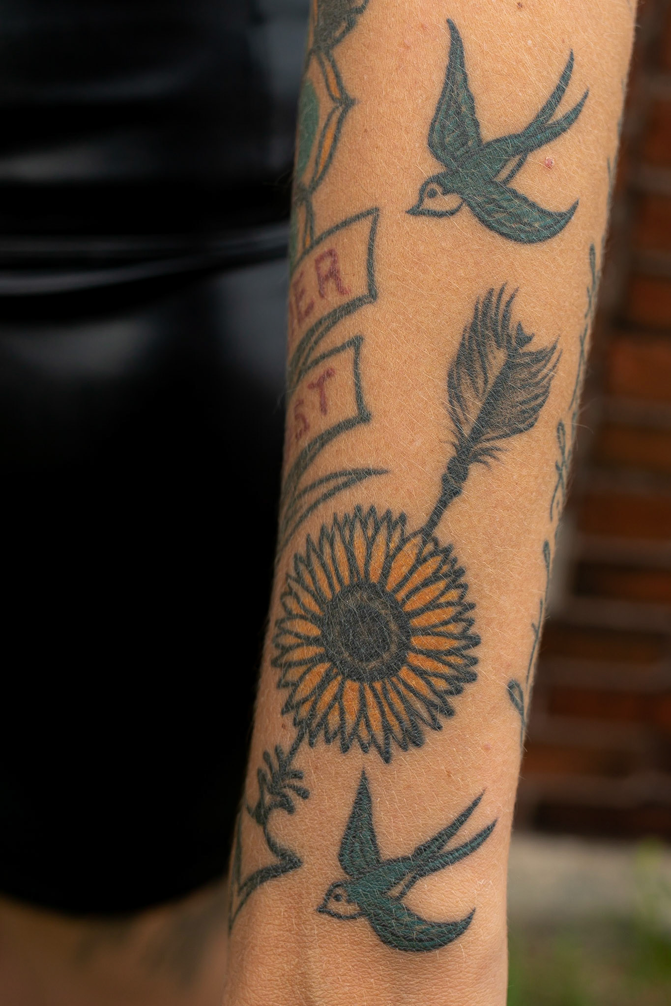 The sunflower tattoo is a 3 generation tattoo I have with my mom and daughter. The 2 blue birds by it are in memory of my grandfather on my mom's side because he had 2 Blue bird tattoos also..