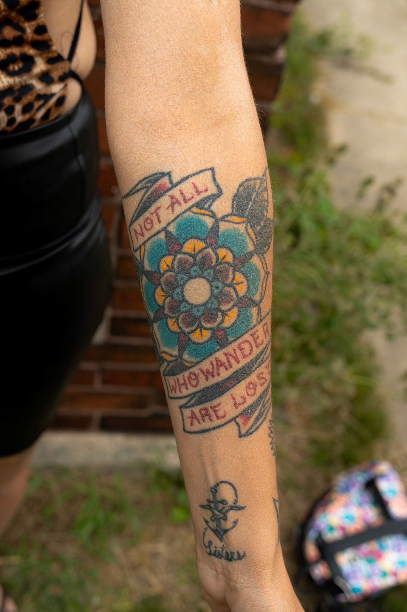 This tattoo has a lot to do with my back story - I went through a lot in my divorce and had a hard time really trusting or believing in relationships. Almost 2 years after my divorce, I met the guy I am seeing now, but he was going through a bad divorce when I met him. After 10 months of getting to know each other and dating, I knew he was the one and I wasn't someone that usually believes in soul mates. He felt it too, but was scared because of what happened in his divorce. He pushed me away and we lost contact for 5 months. I got this tattoo during that time because I knew it wasn't the end of our story. We lost each other along the way but came back together and have been for almost 6 years. I loved the quote "not all who wander are lost" because even when scared and dealing with stressful things in life, you can still find your way back to each other when it's meant to be - and you just fit together and work together so well. It is a daily reminder now of that, and how our relationship is stronger for that and all the stressful things in life that make you lose sight of things - family passing away or losing a job - that makes the wave in your path. It's my reminder of what really matters and what you want for yourself, to always keep on keeping on, just because there's a bump in the path, not all is lost.