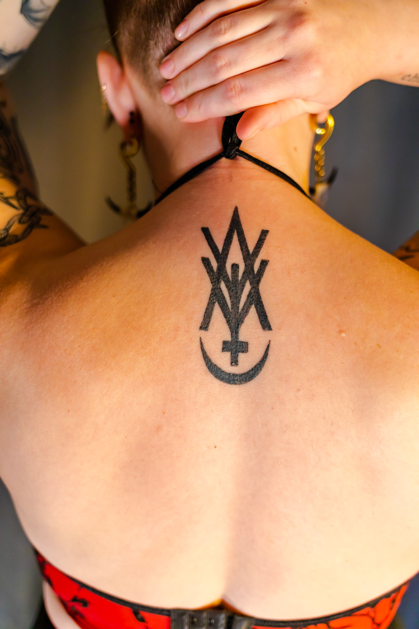 One of my good friends Tesslyn tattooed this for me a while back. It's the sigil for our favorite band Amigo the Devil. His music means so much to me, and any time he's in town Tess and I go to see him together. It only seemed fitting to let her tattoo this on me.