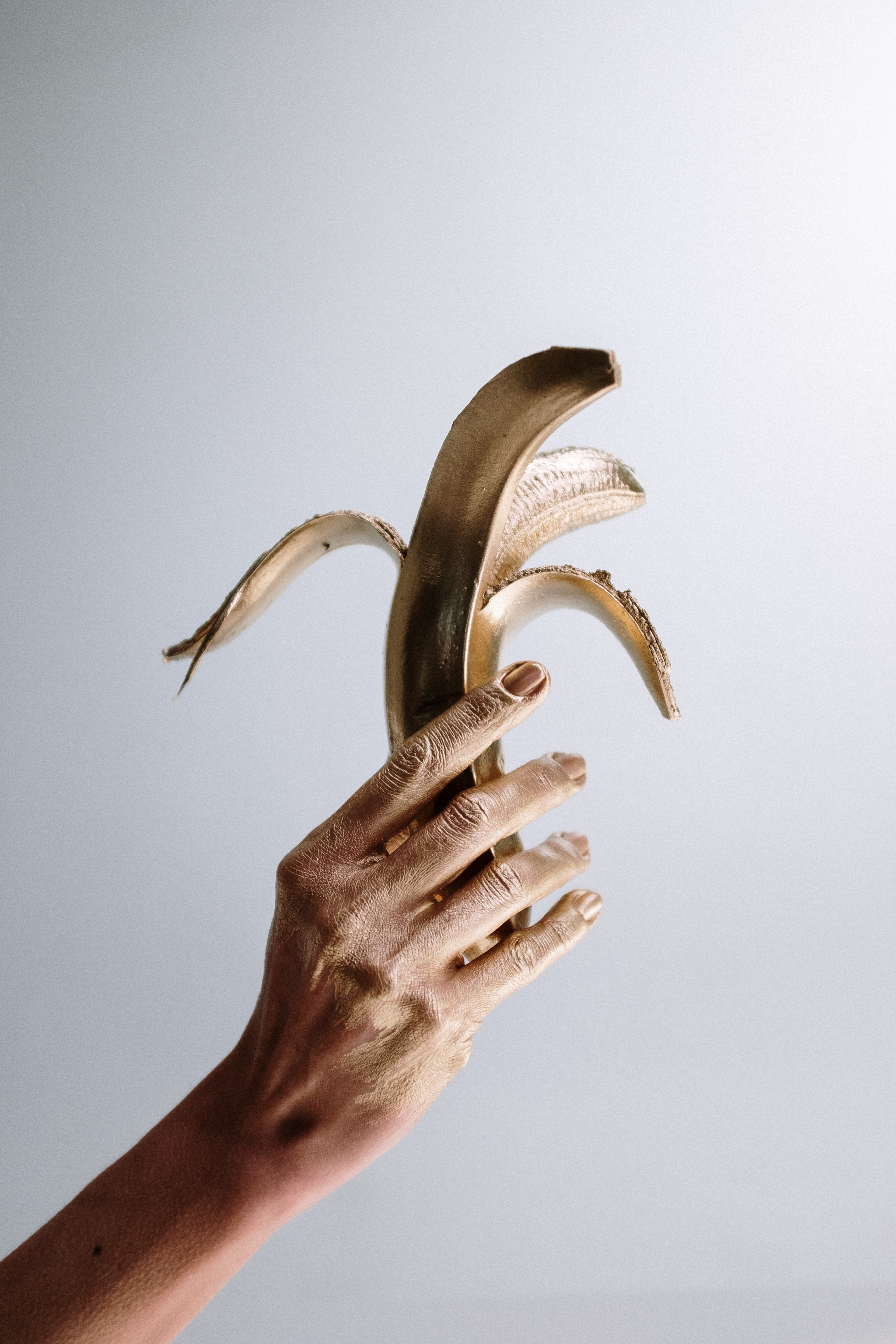 https://www.pexels.com/photo/photo-of-person-holding-golden-banana-4631885/