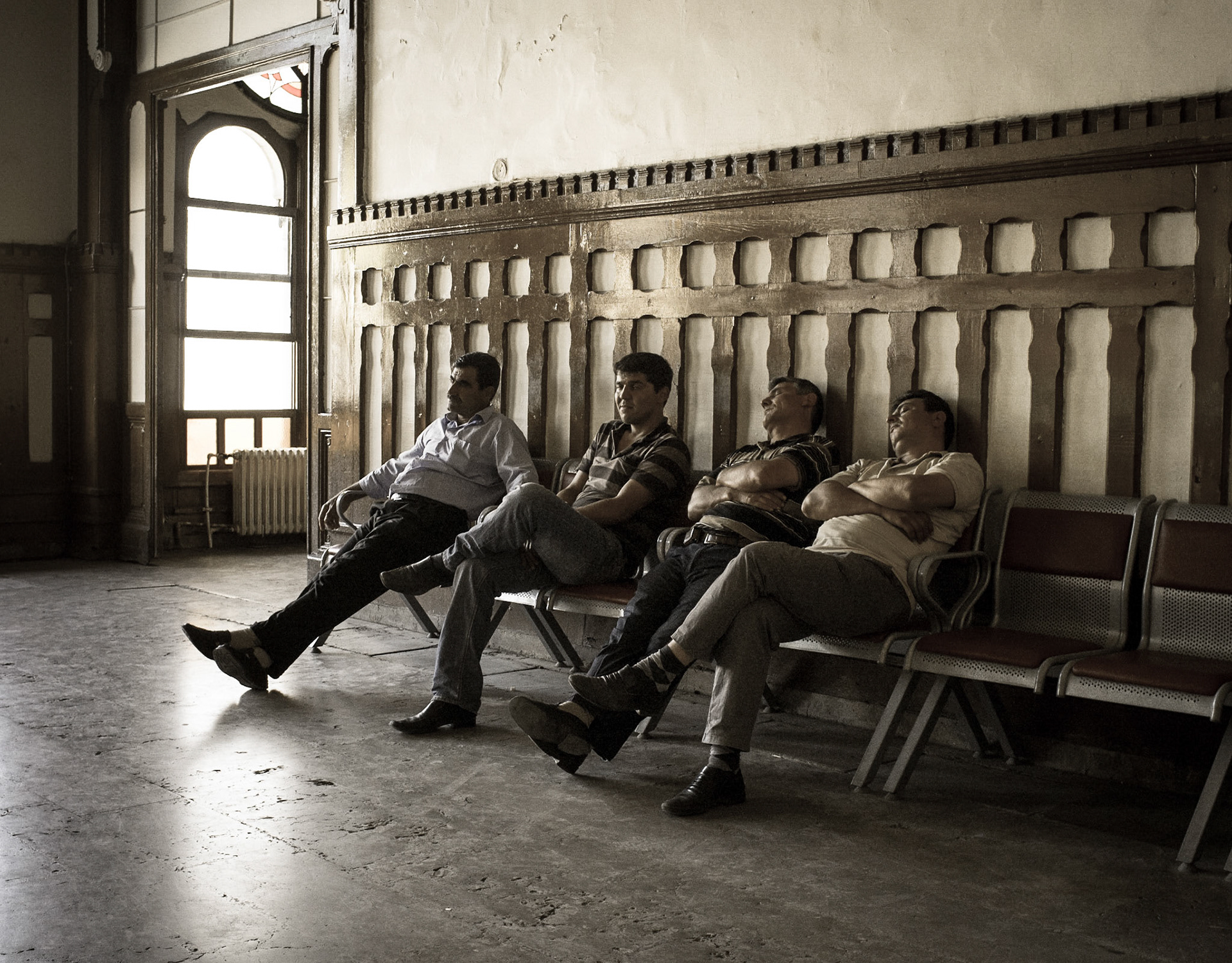 Men taking a nap in Istambul Grand Central Station