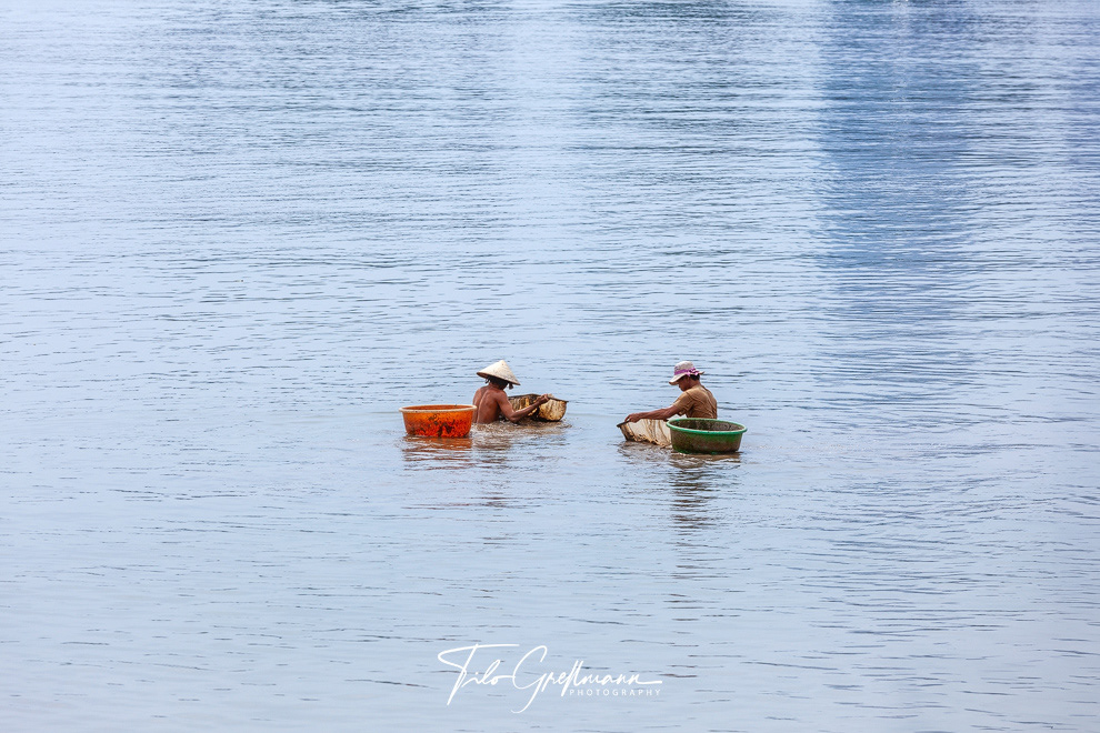 Fishermen in the Saigon River (Vietnam)