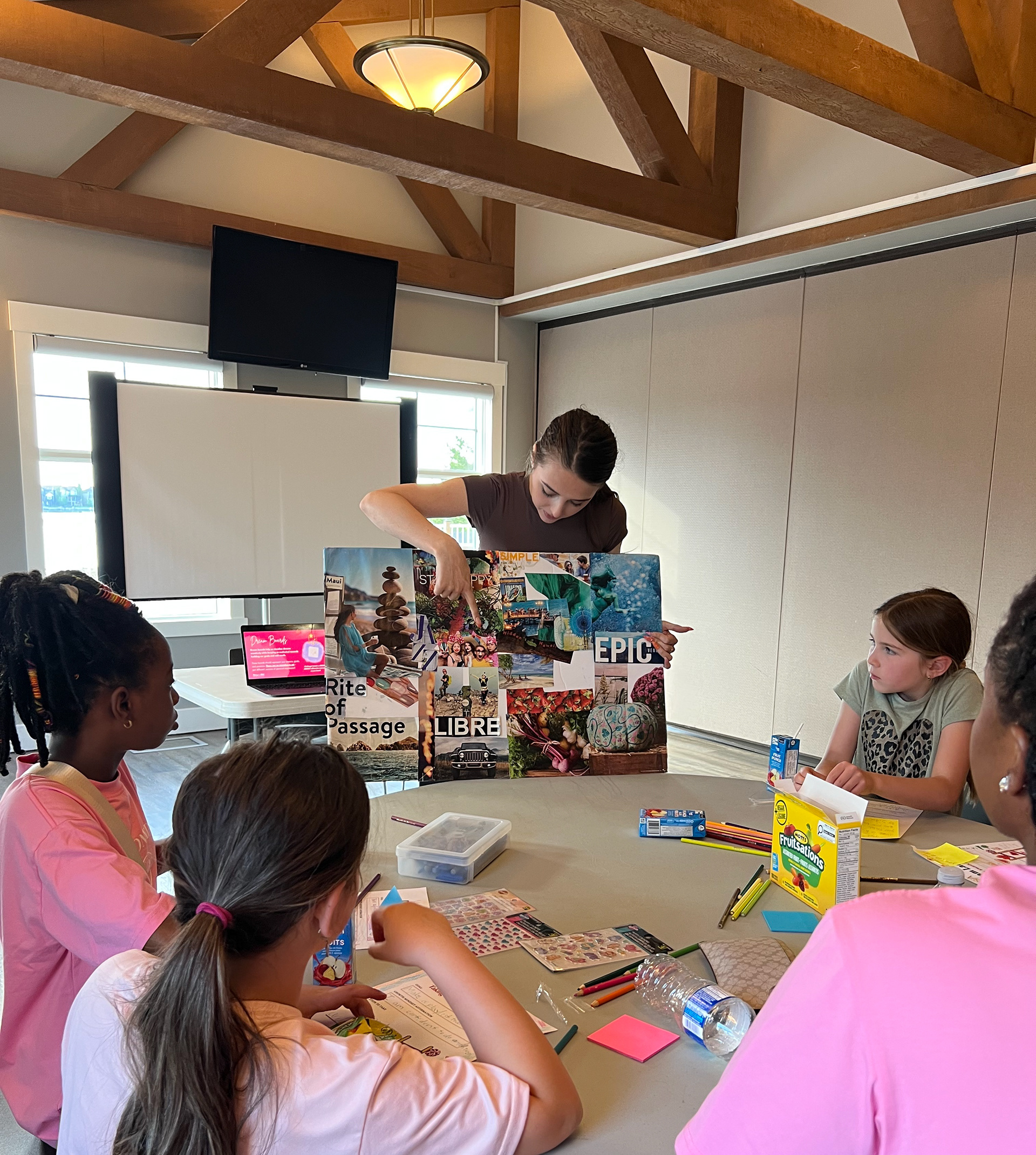 Showing a vision board while explaining its purpose