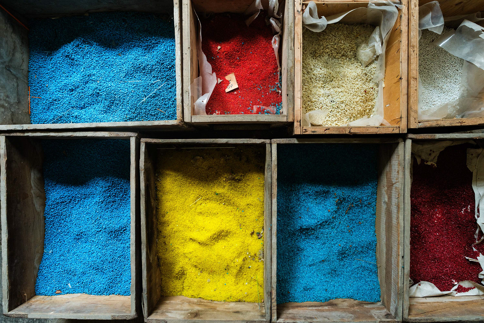 Murano, Italy. Conteria glassbeads stored in ancient wooden crates, orignally used for shipping. 1/125 sec, f. 3.2, ISO 800 – 12 mm.