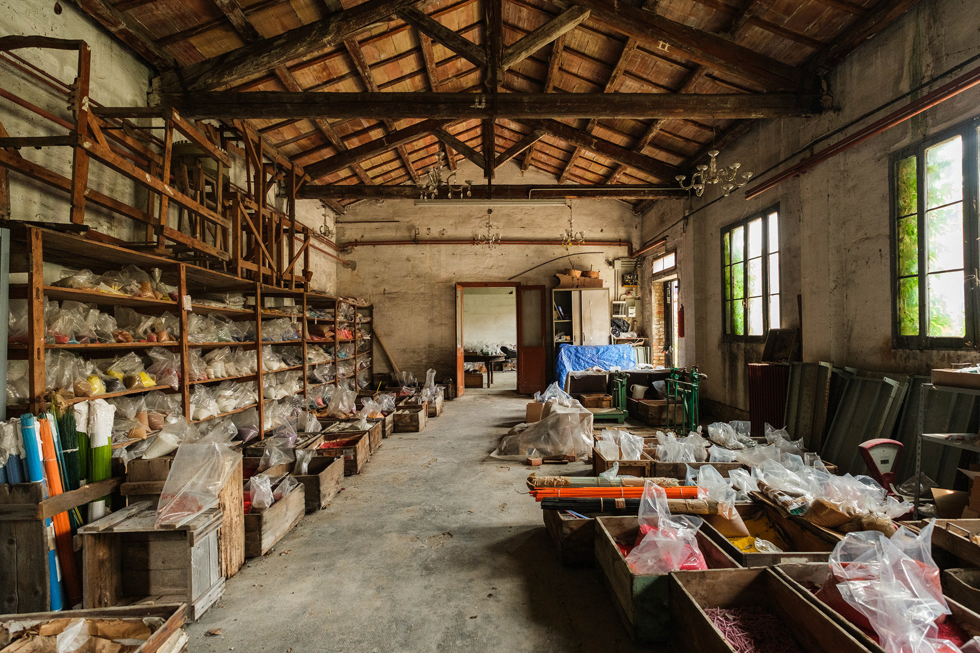 Murano, Italy. The corridors of an old bead factory now house the warehouse with the production of the past – 1/125 sec, f. 3.6, ISO 1250 – 12 mm.