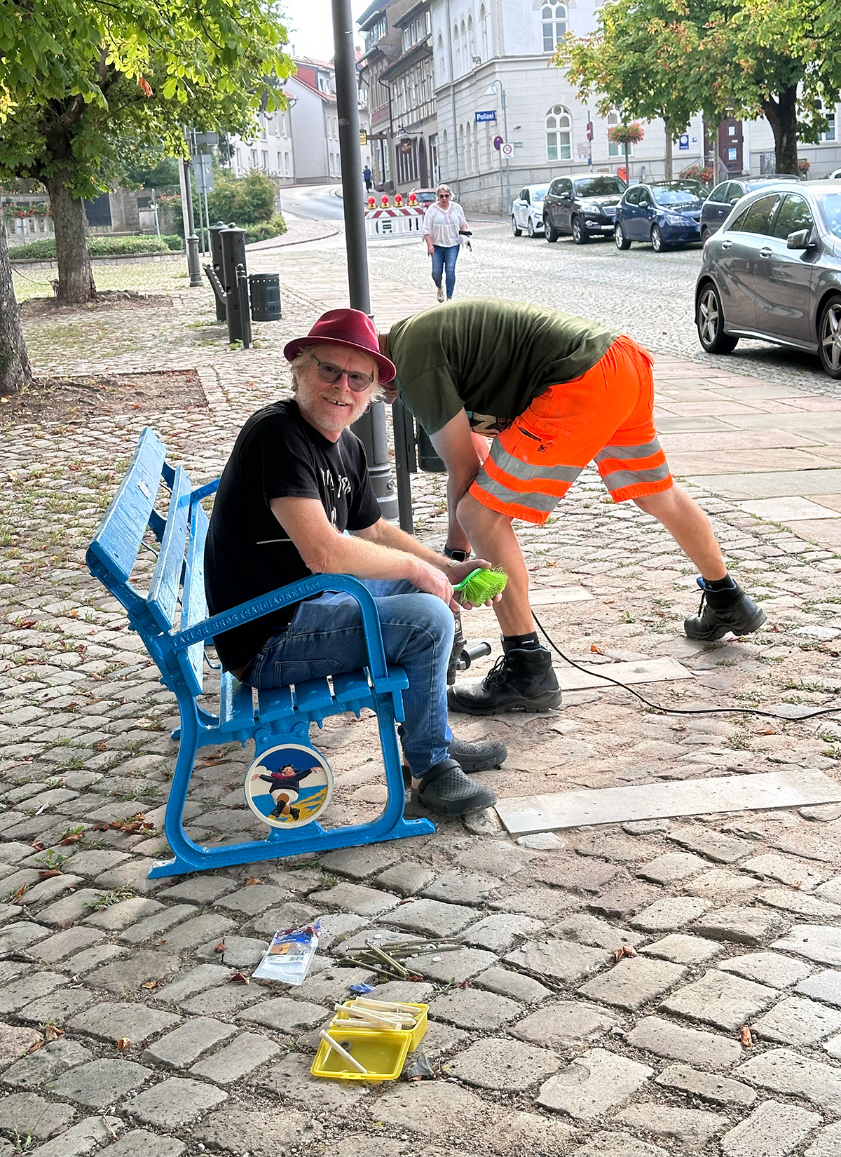 Artist John Byford during installation of the bench. 