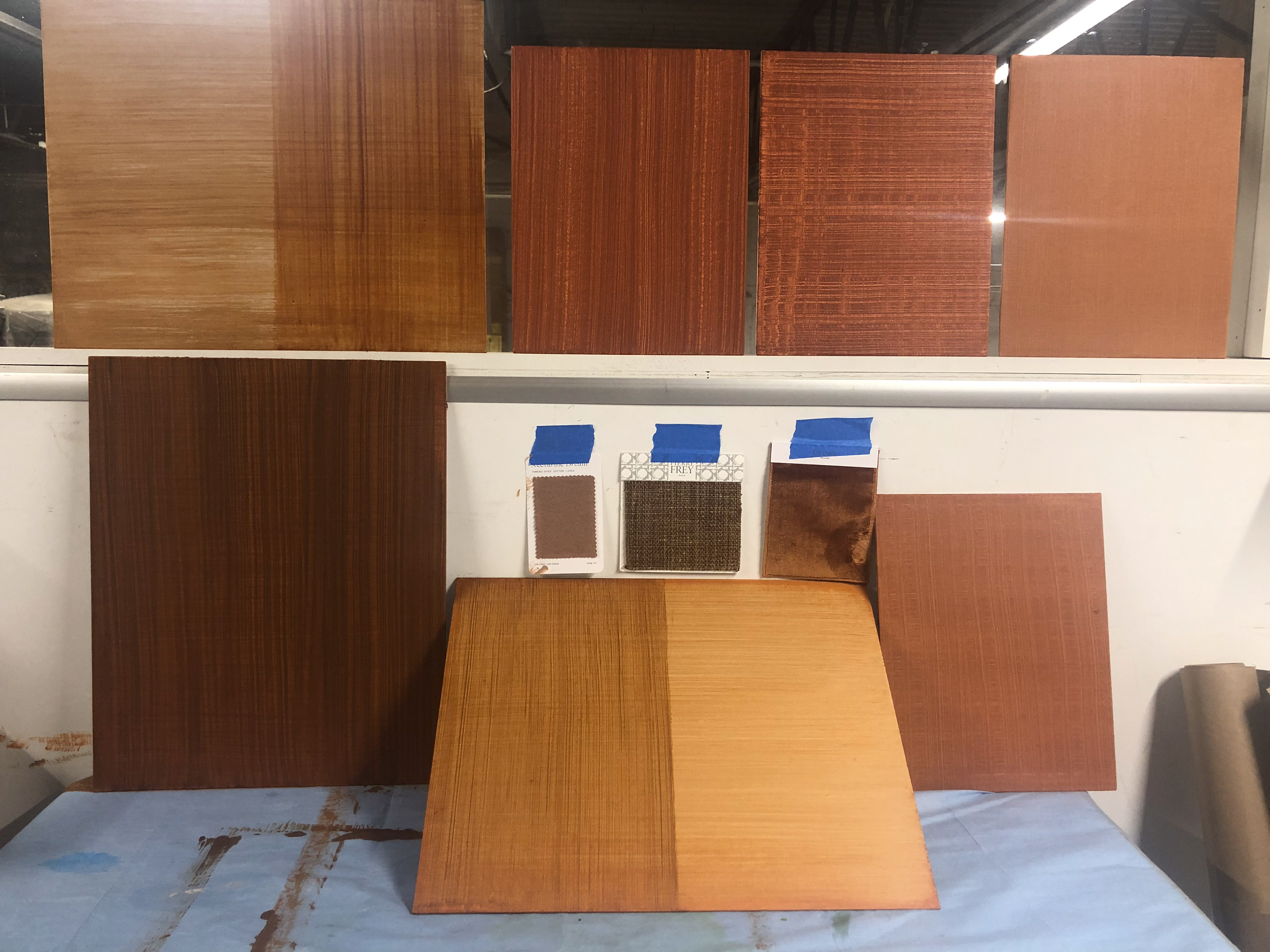 With rust, color selection, fabric samples and the surrounding design elements of the nursery furniture and mural in mind, I created these samples to test out in the space with my client. 