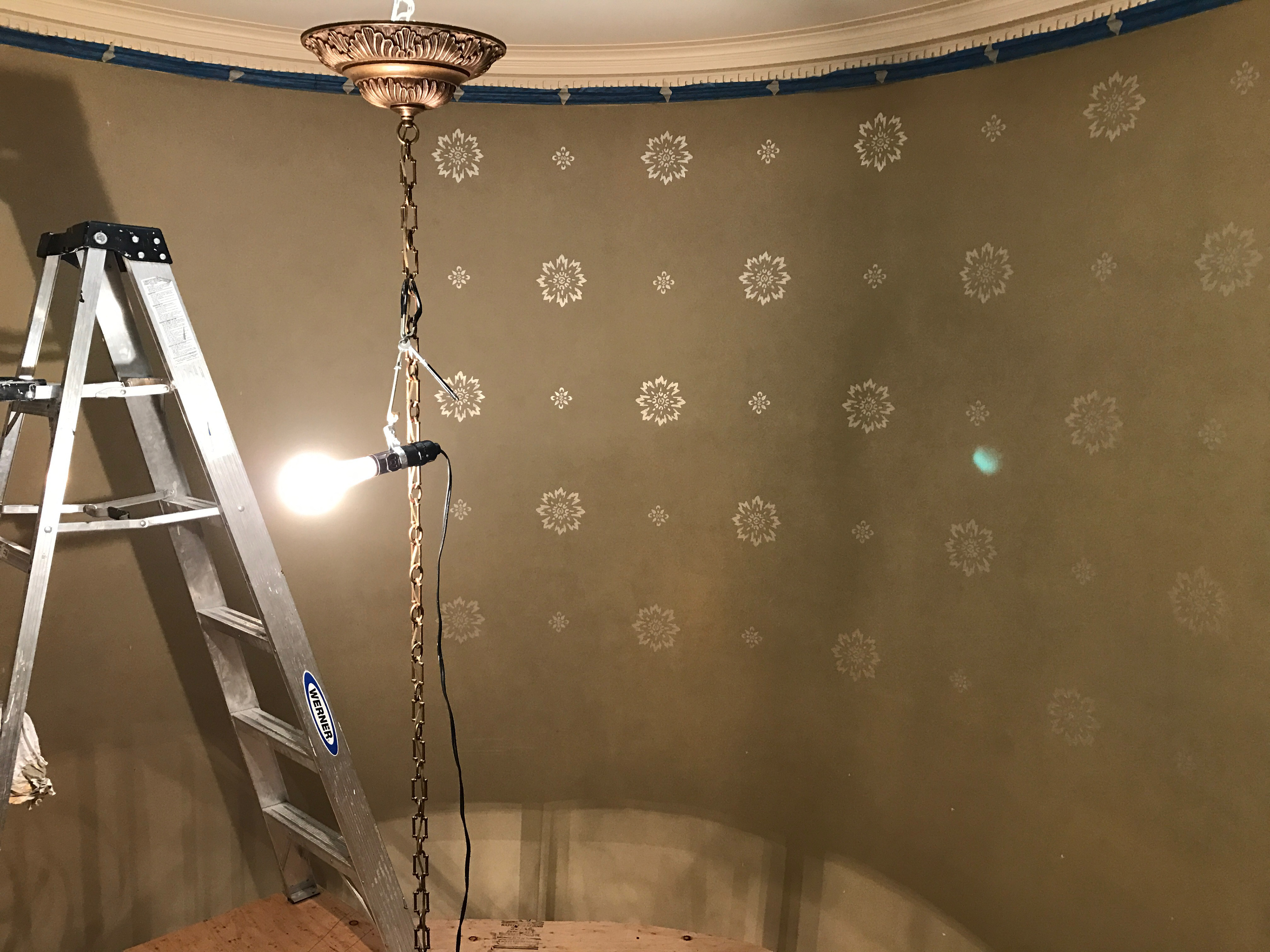 Stairwell stencil measured and painted in for Christianson Lee Studios
