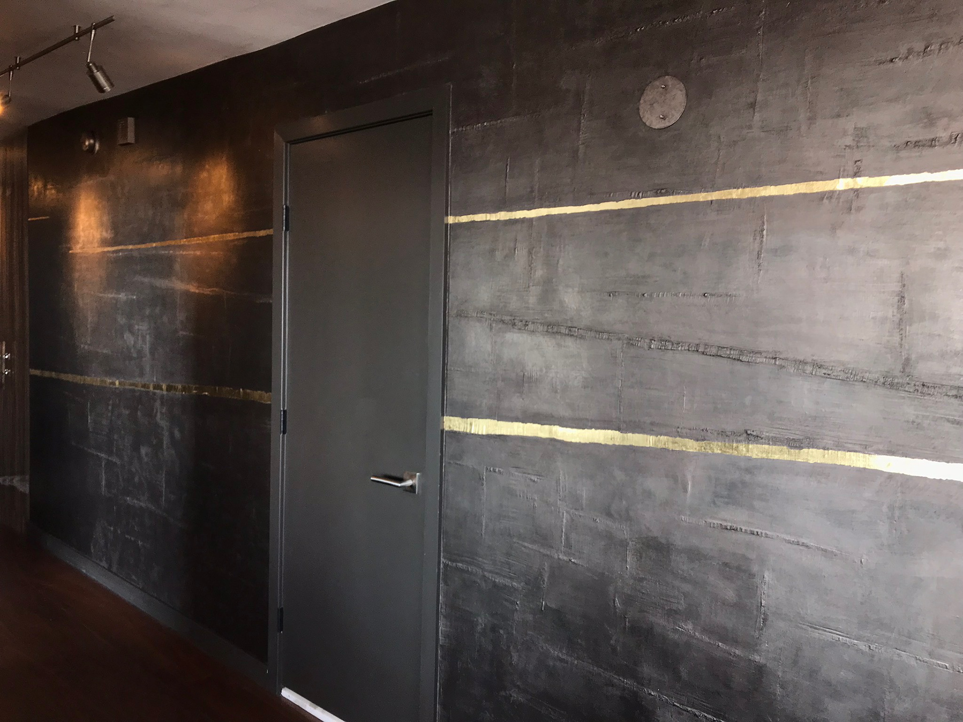 Gilded kitsugi on lime plaster finish in collaboration with Ben Lai