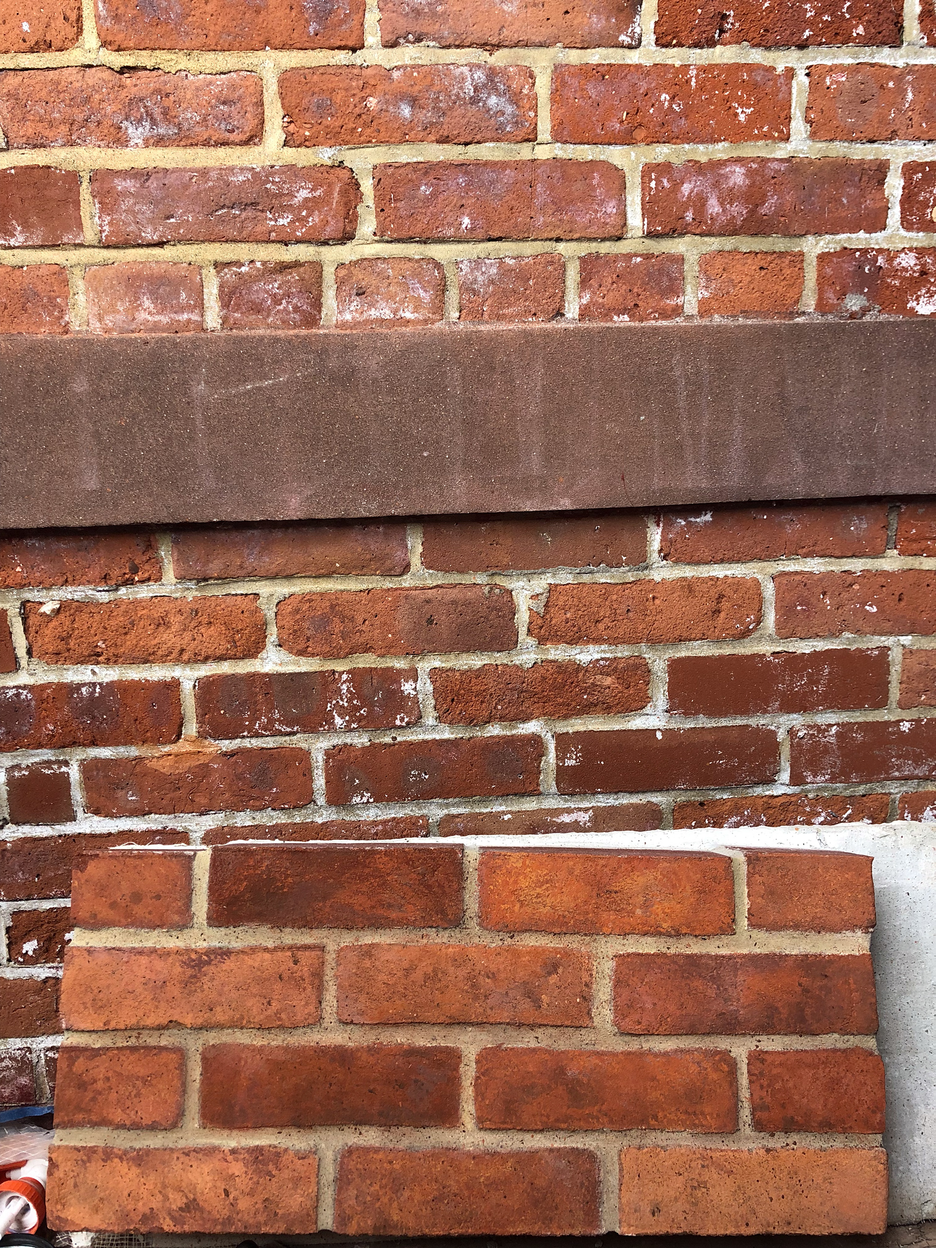 Painting a sample board to match the exterior of a historic building on the promenade in Brooklyn Heights.