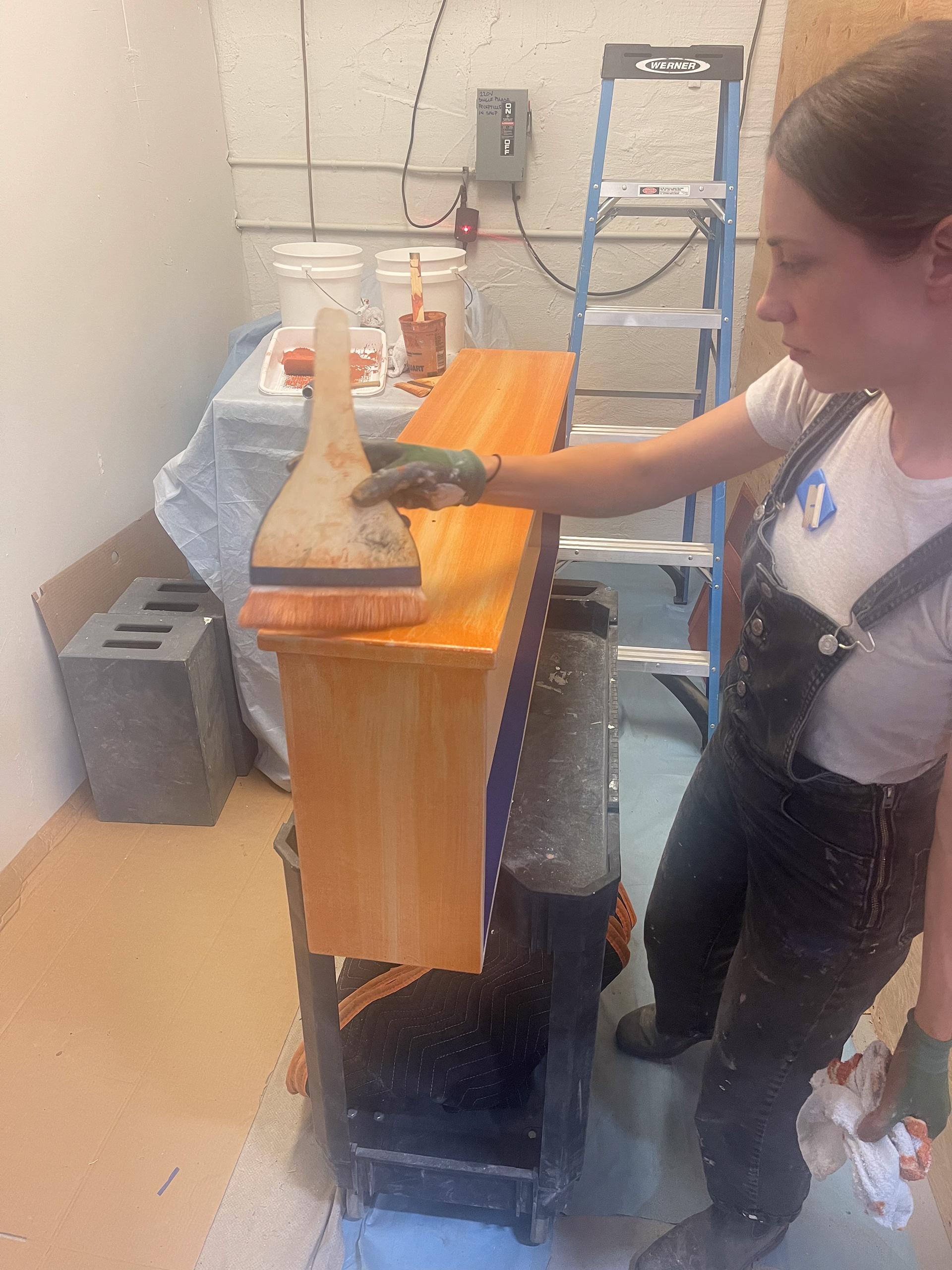 After priming and spraying two coats of the custom base coat, I applied a first pass of a washy orange glaze, creating the mid-tones of our finish.