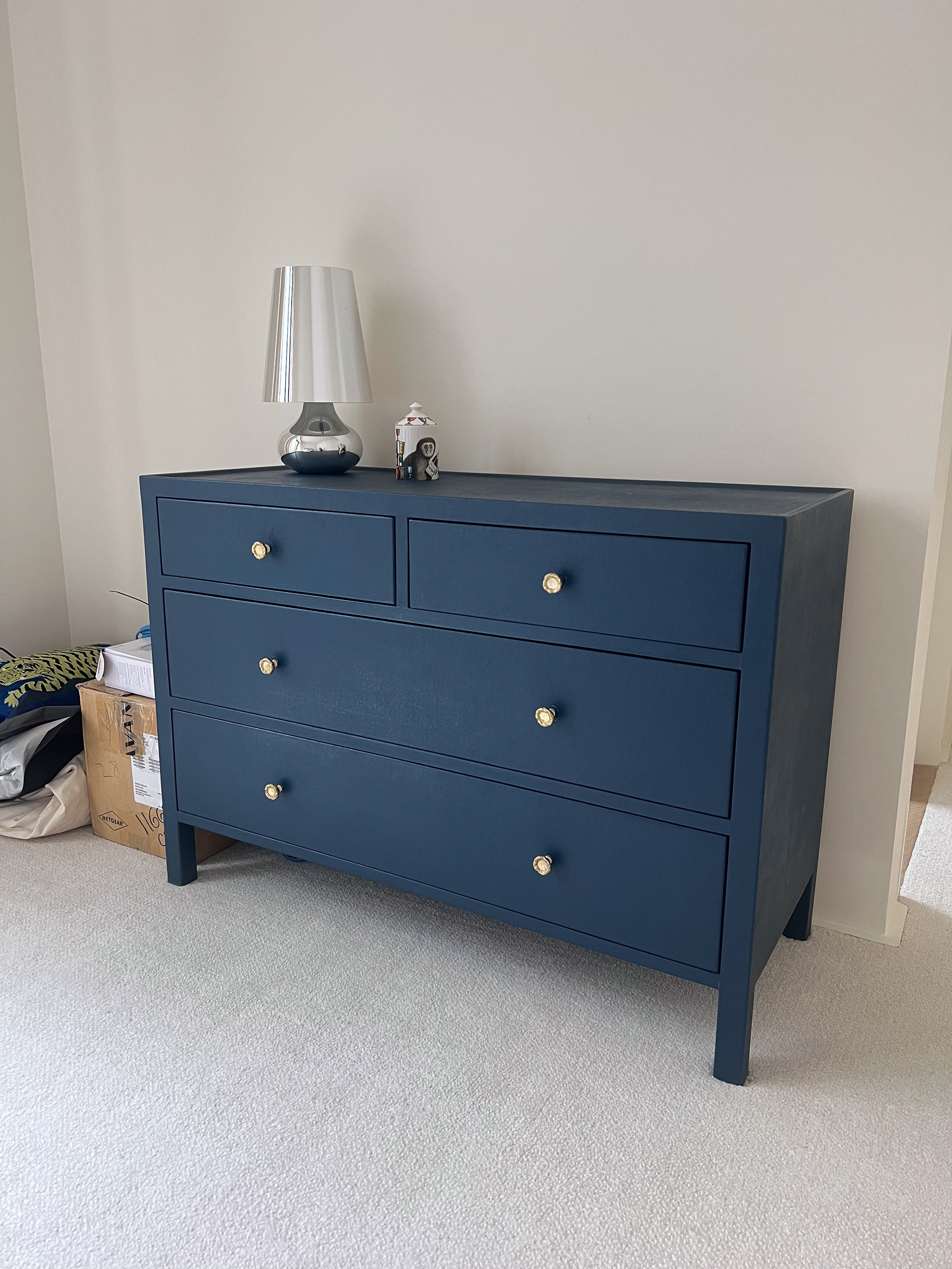 My client had this perfectly useful dresser but the color and brass knobs no longer matched the concept design for her future nursery..