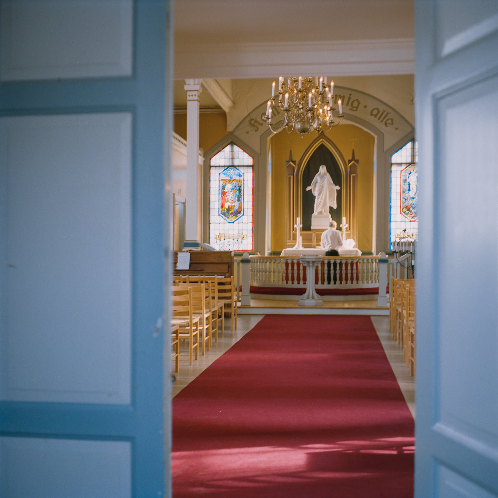 The churchwarden, Øystein Mollestad, prepares Nærsnes church for a service.