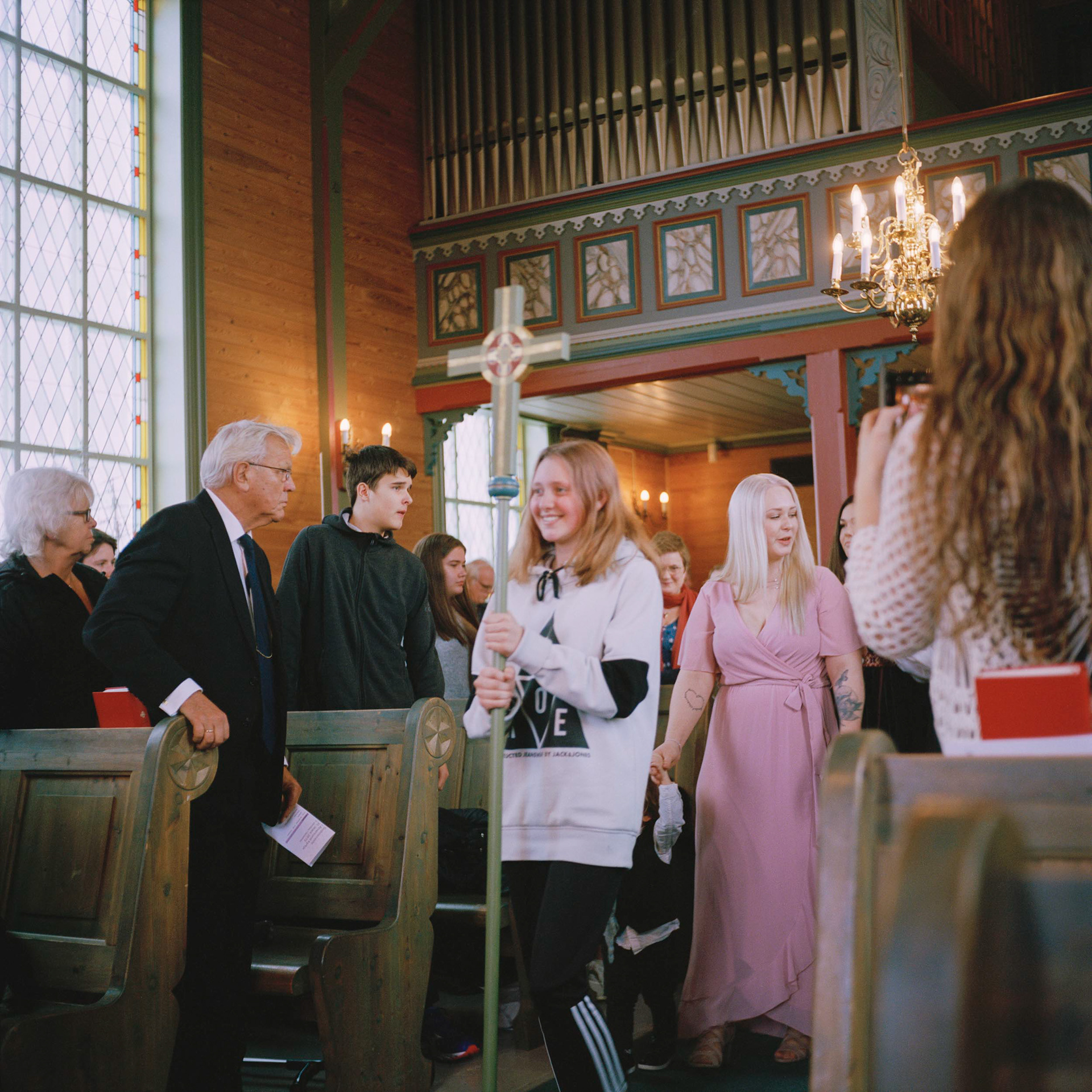 Confirmant Laura Osland Øvretveit leads the entrance procession during a service in Alversund church in Nordhordland.