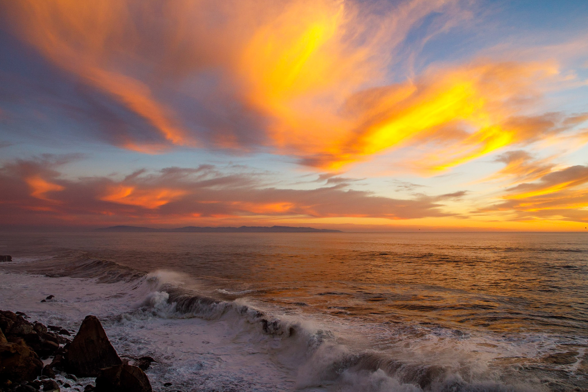 Sunset over Monterey Bay from Westcliff Drive, Santa Cruz, Ca. Monterey in the distance and Pacific Ocean on the right.
