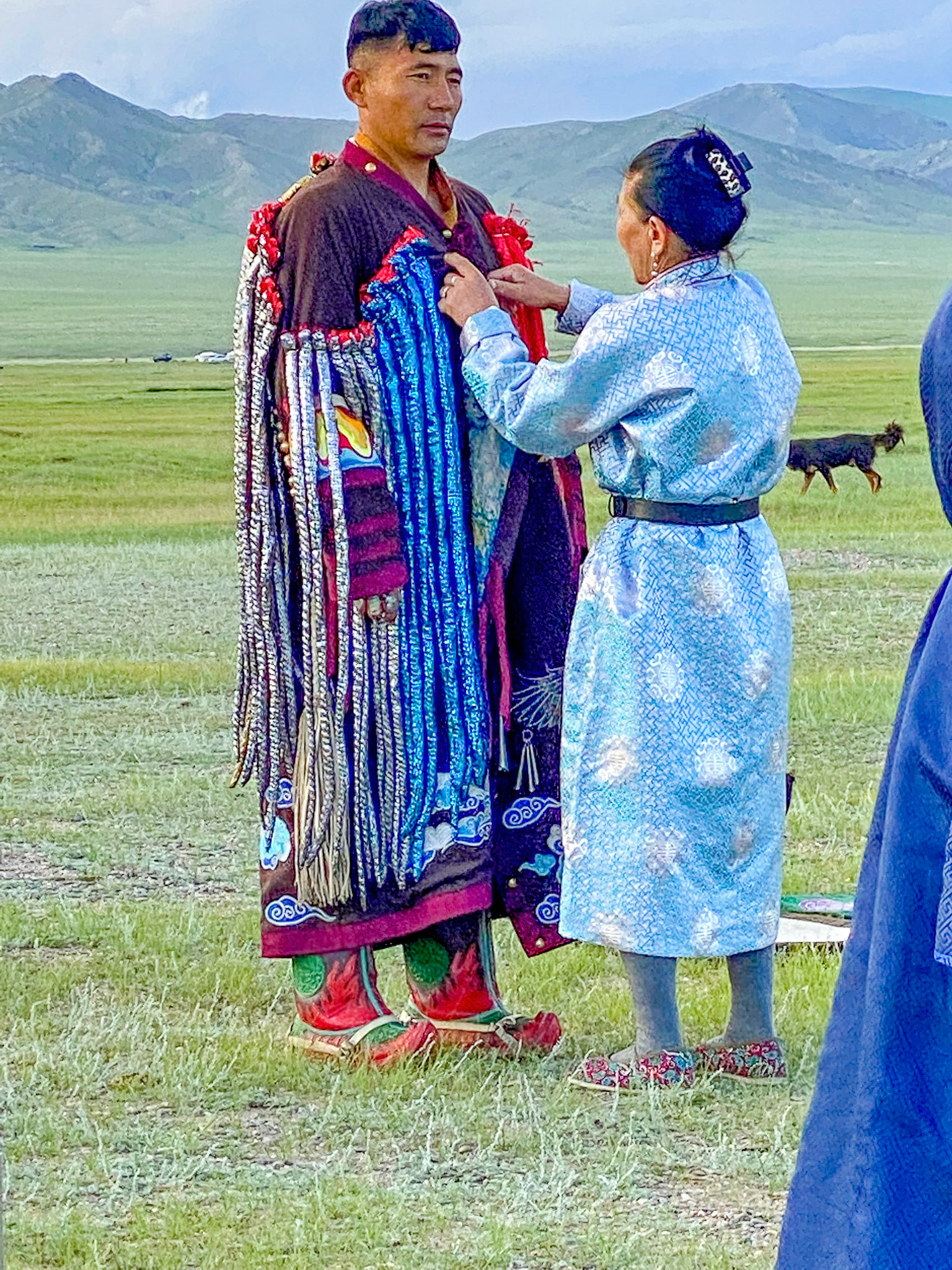 Mongolian Shaman and assistant preparing for spiritial encounter