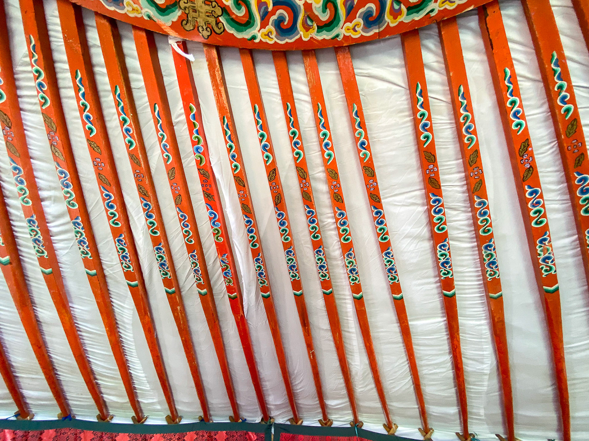 Ceiling ribs are gayly decorated