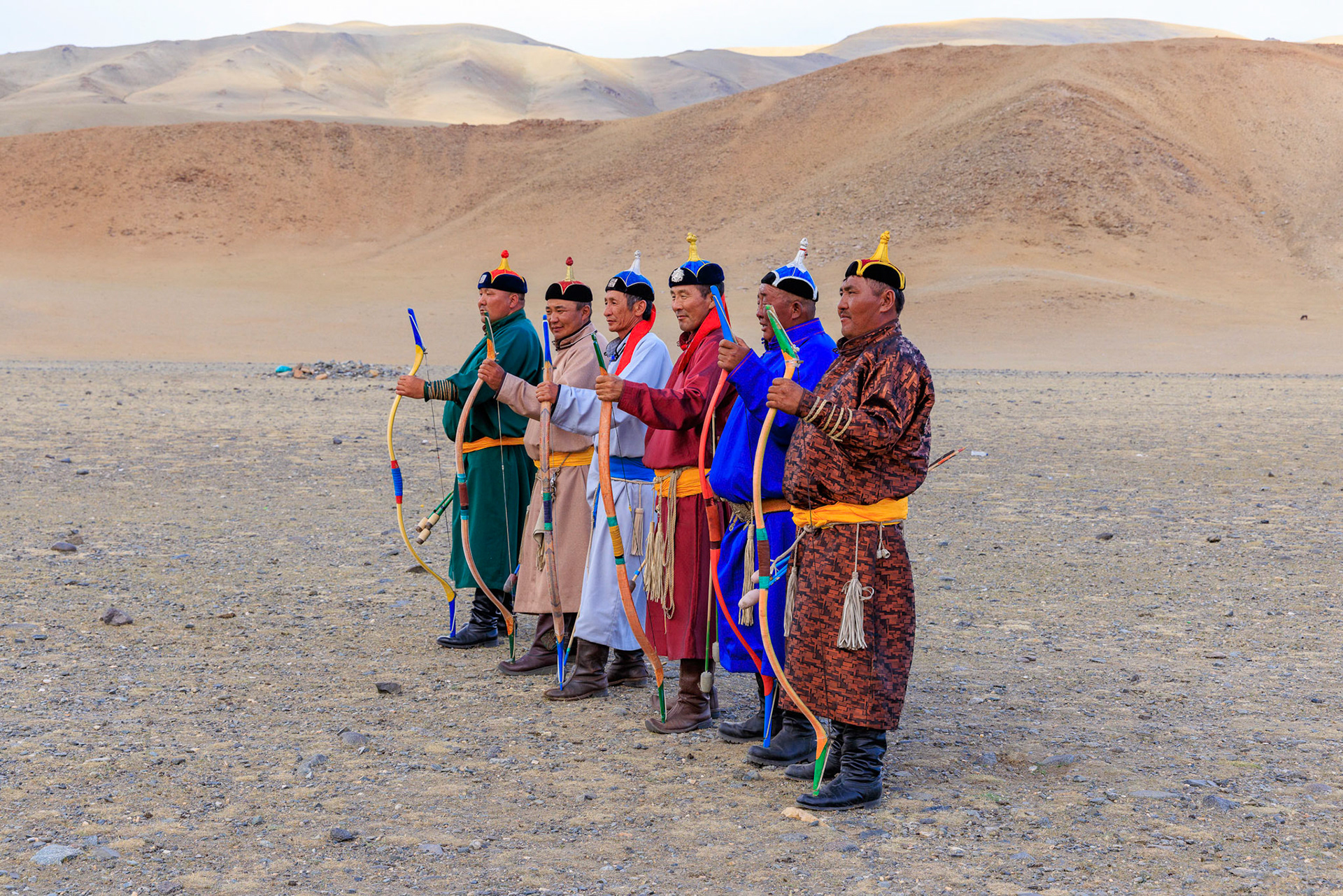 Top archers as noted by head gear and neck scarf