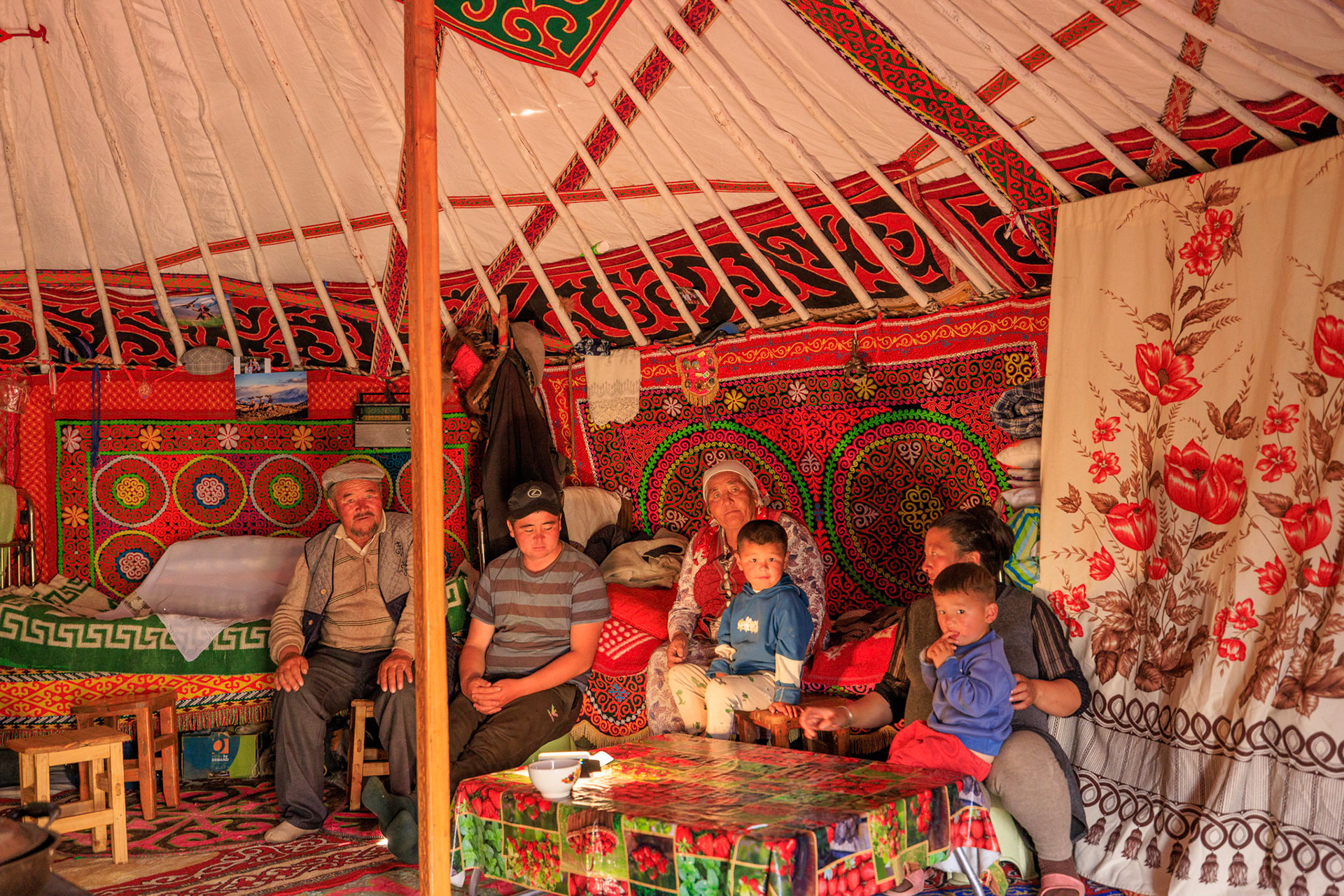 Sailua, their son Serikjan, Pensiya, grandkids and Serikjan's wife. They all live in this Ger.