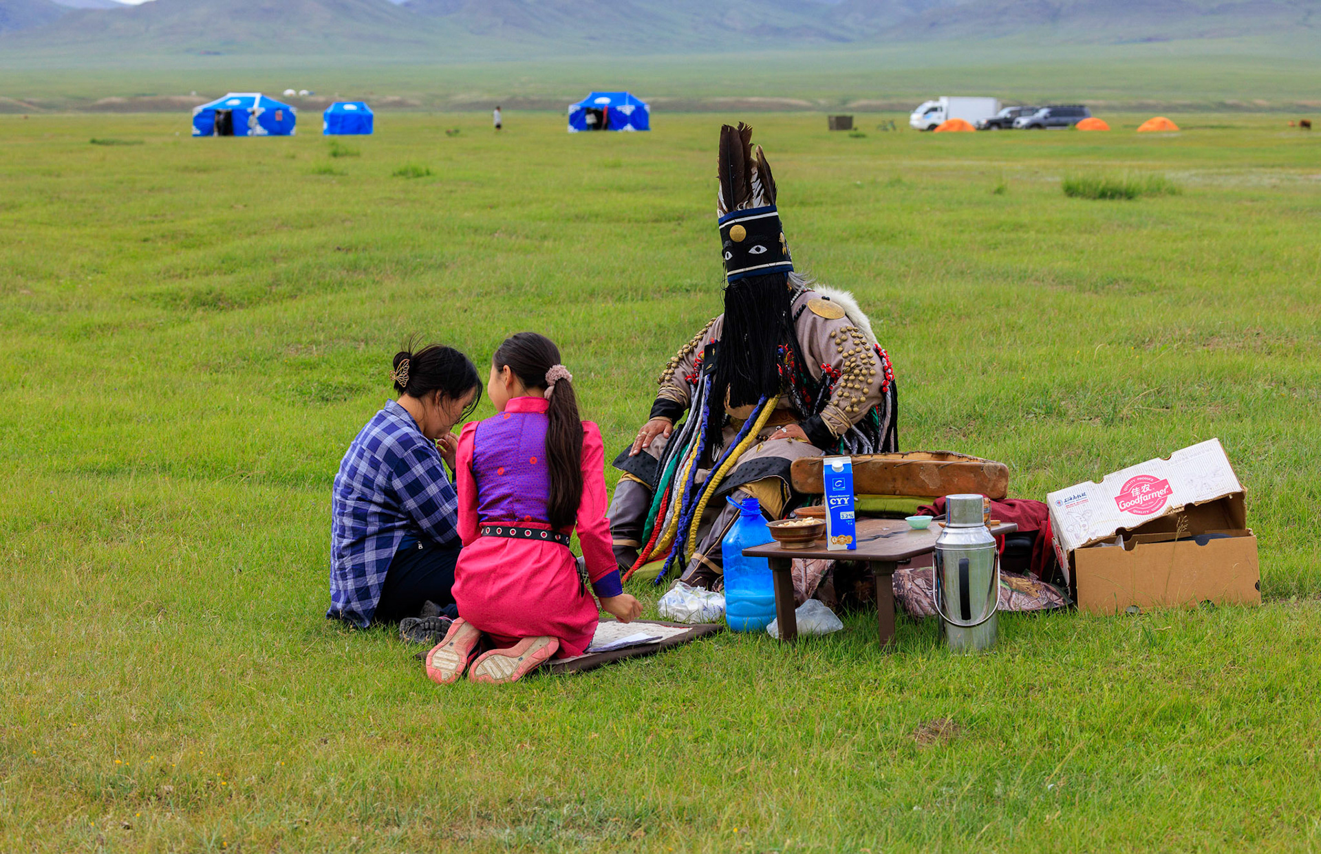 Mongolian Female Shaman and assistants preparing for spiritial encounter