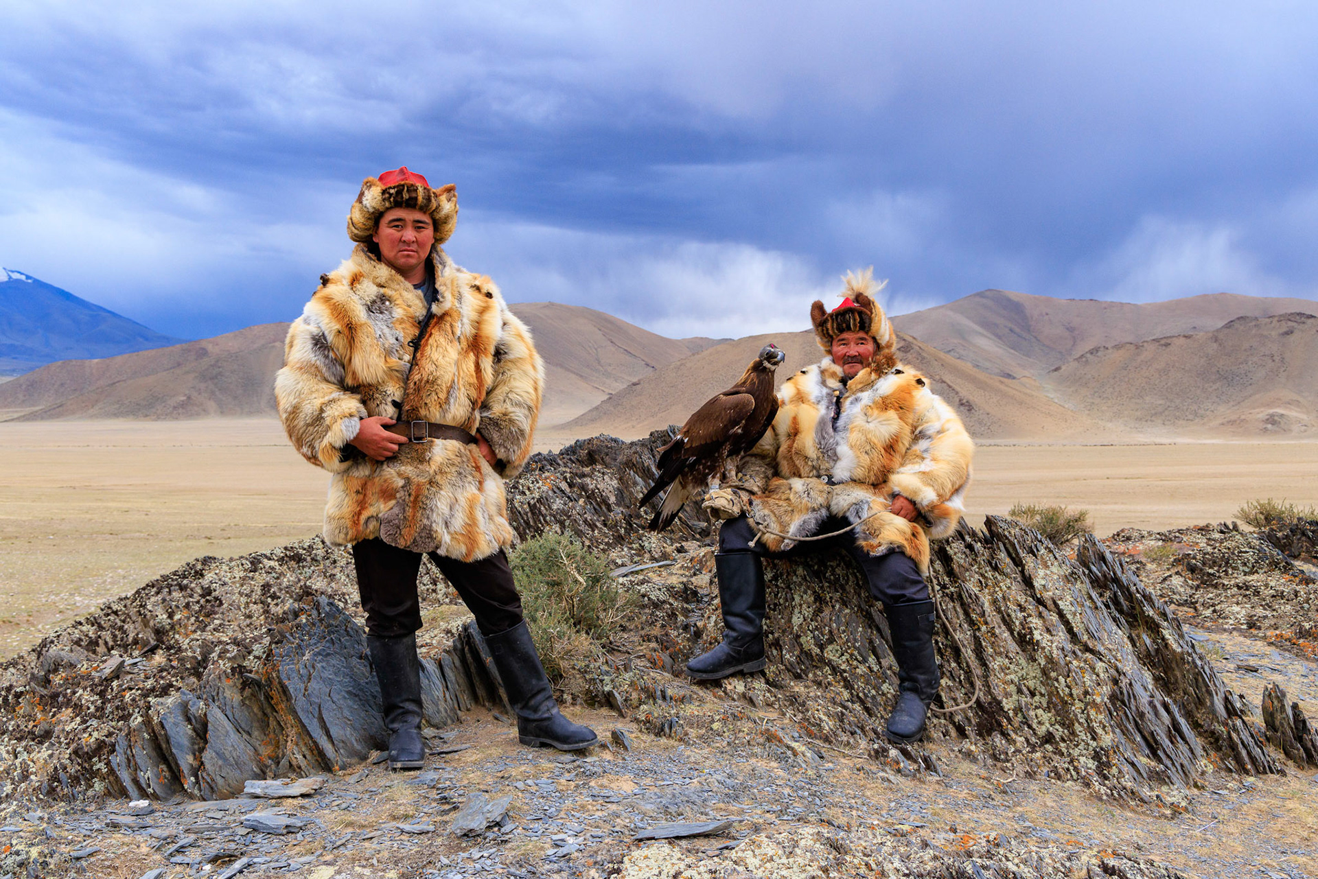 Kazakh Eagle Hunters Serikjan and Sailua with Sailua's Golden Eagle