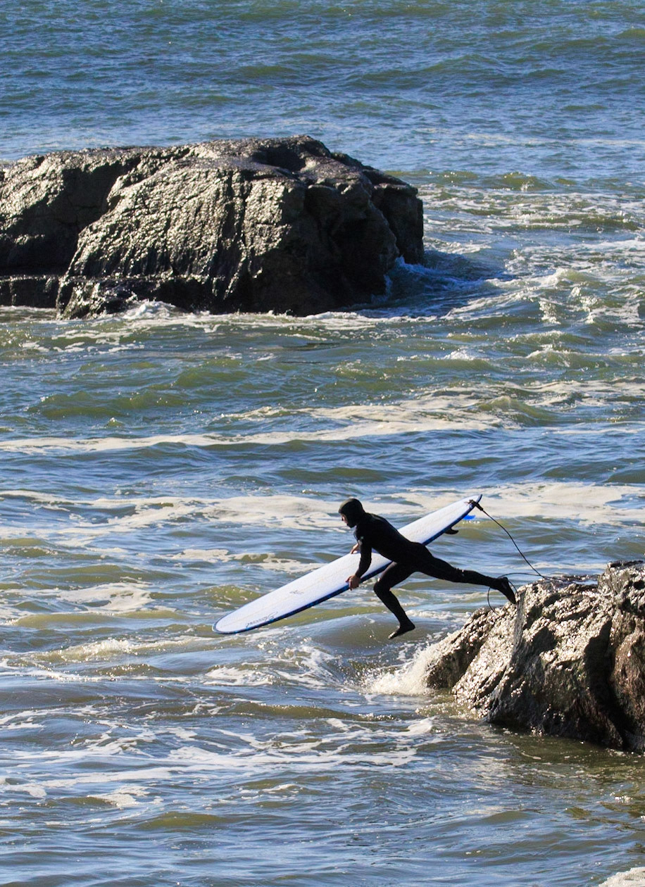 Dropping into Steamer lane from Lighthouse Point.