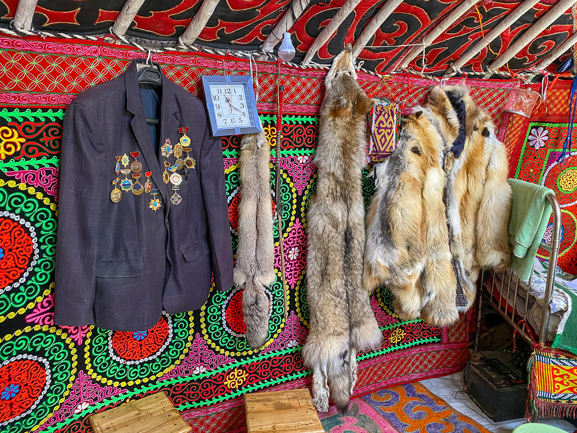 Wolf pelt, fir coat and medals of honor