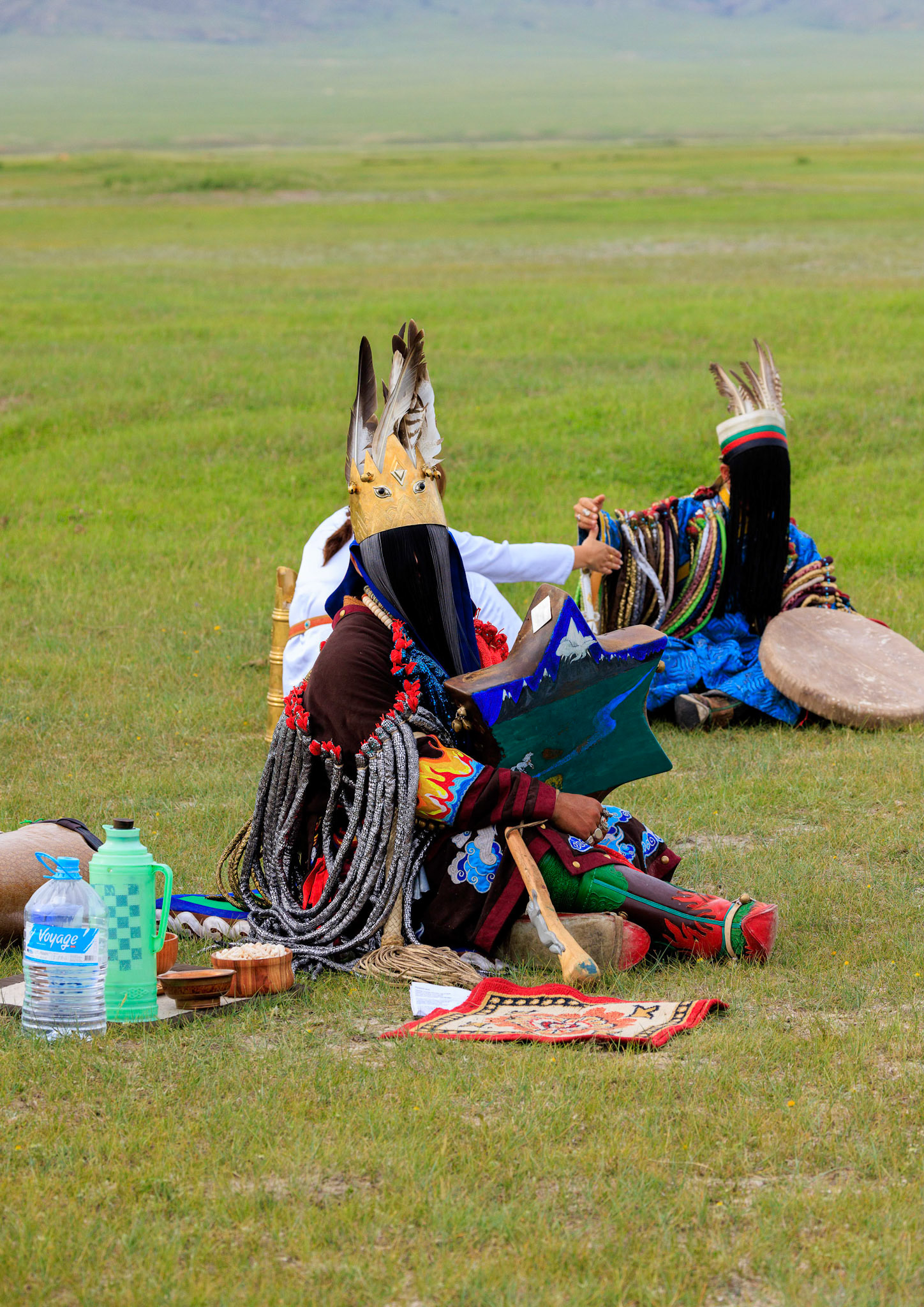 Mongolian Male Shaman and assistants preparing for spiritial encounter