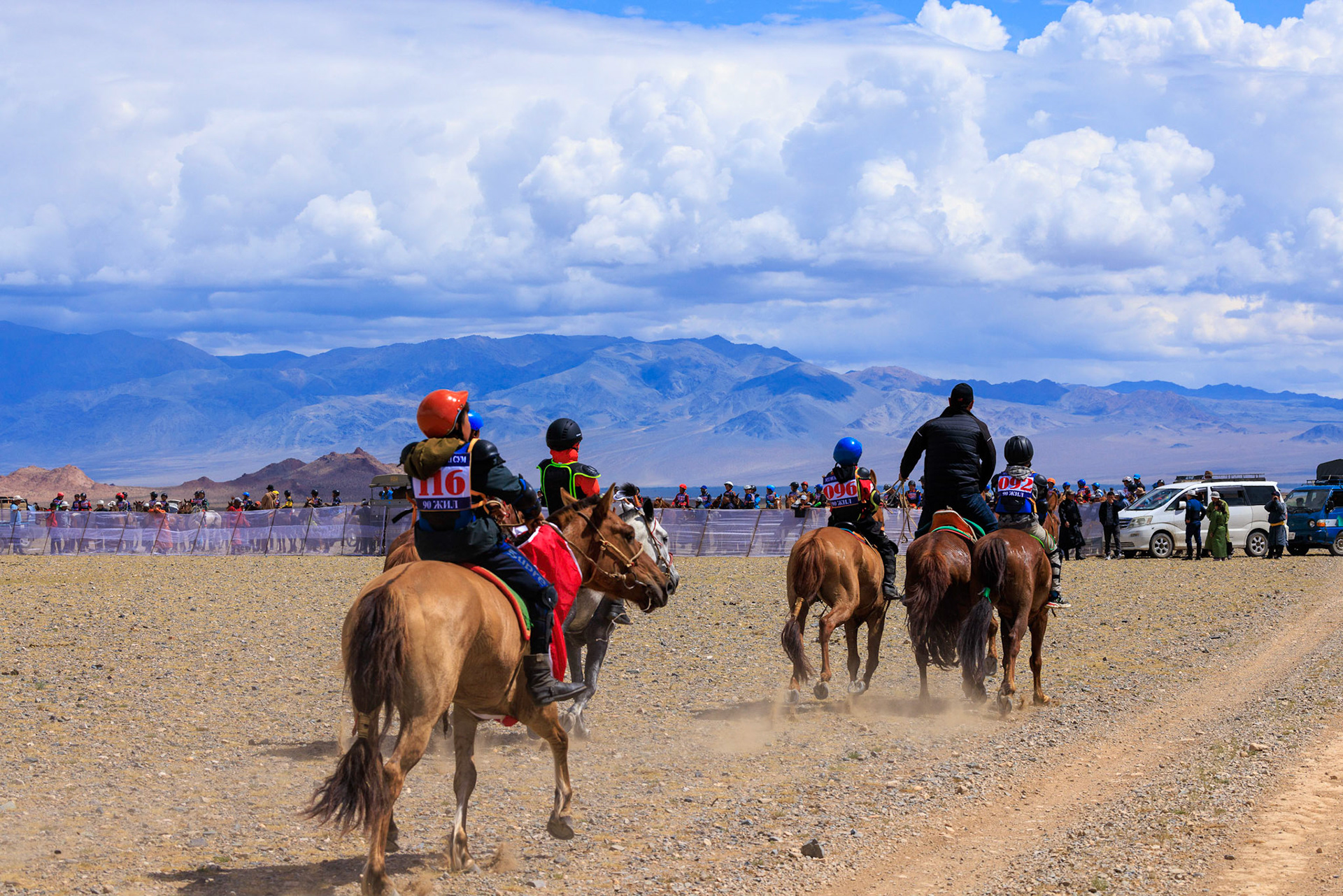Racers arriving. Riders are 4-14 years old and ride bareback.  There are about 30 different categories for horses and riders. They ride to the starting line from miles away.