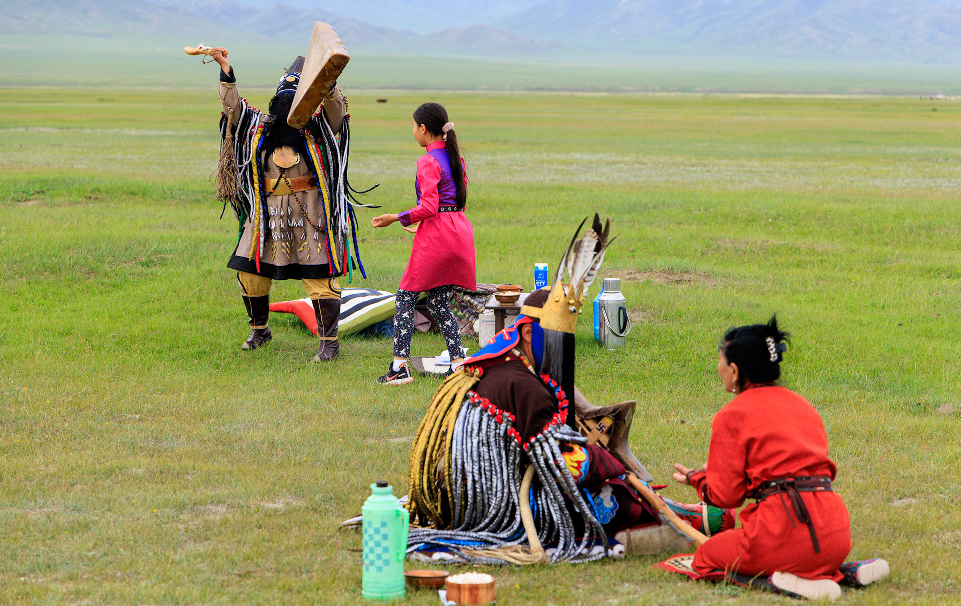 Mongolian Shaman and assistants preparing for spiritial encounter