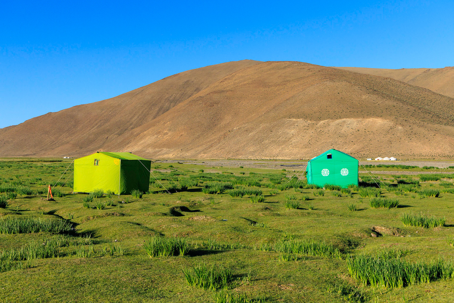 Toilet tent on the left, shower tent on the right