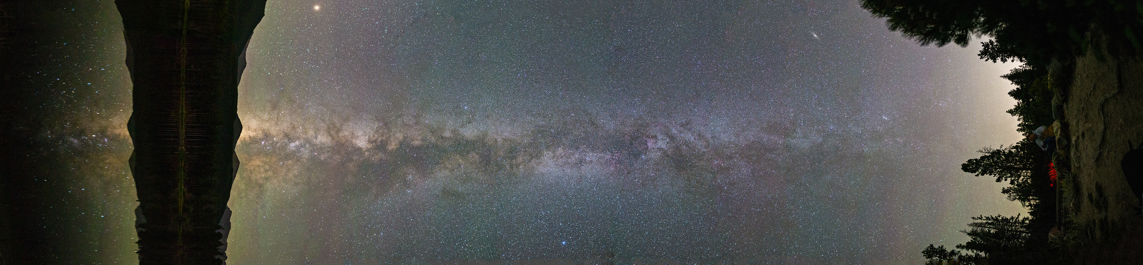 This image captures a 180 degree view of the vertical Milky Way in Rocky Mountain NP with Mars, a meteor, and the Andromeda Galaxy.