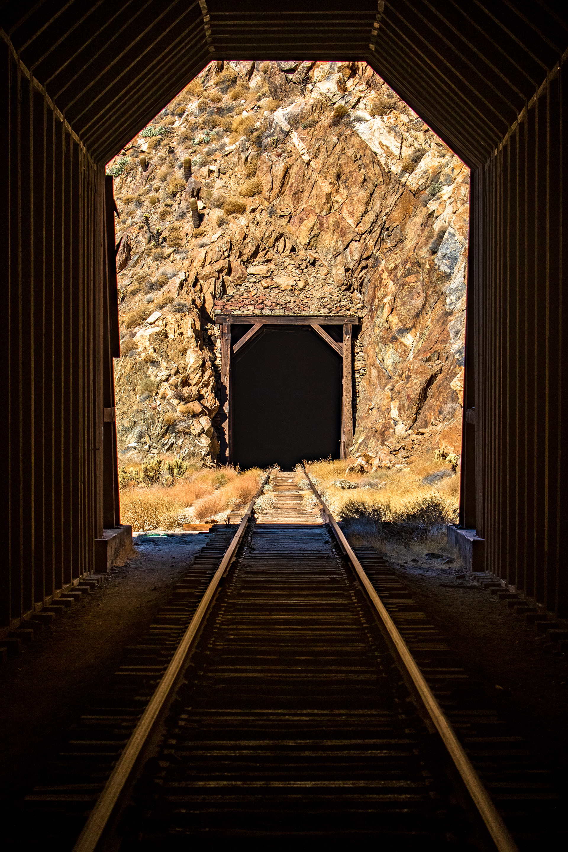 A view from one tunnel to another along an abandoned railroad in Southern California.