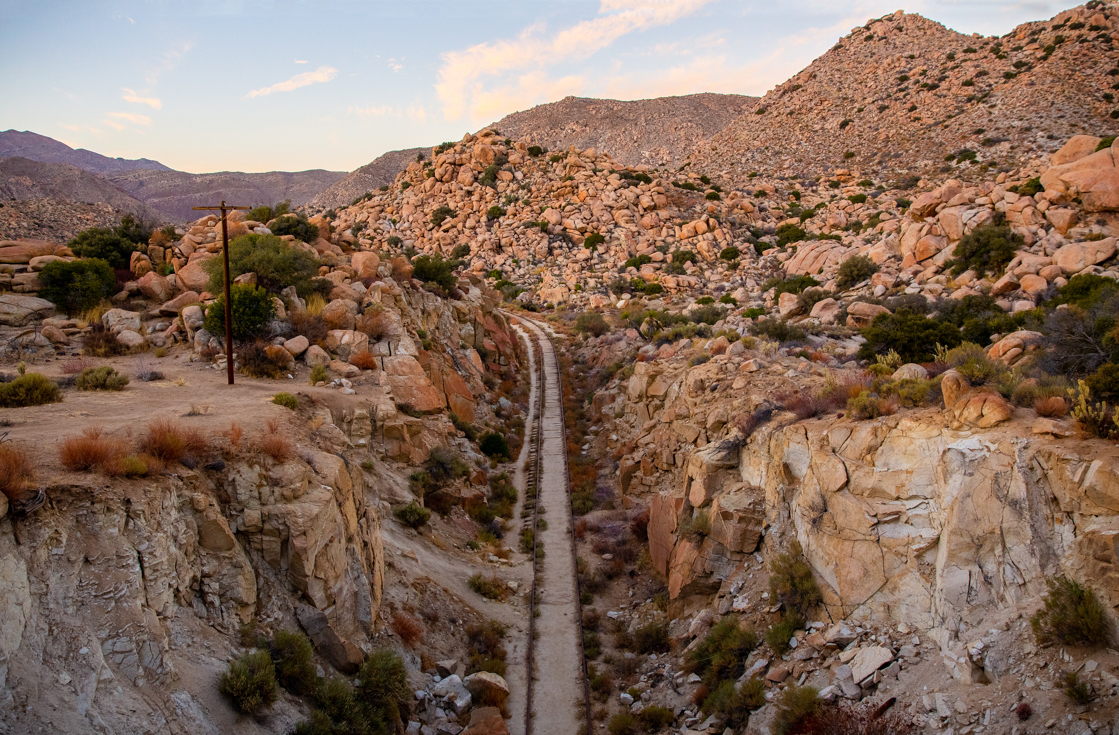 The rocks of the Southern California desert glow softly as the sun sets.