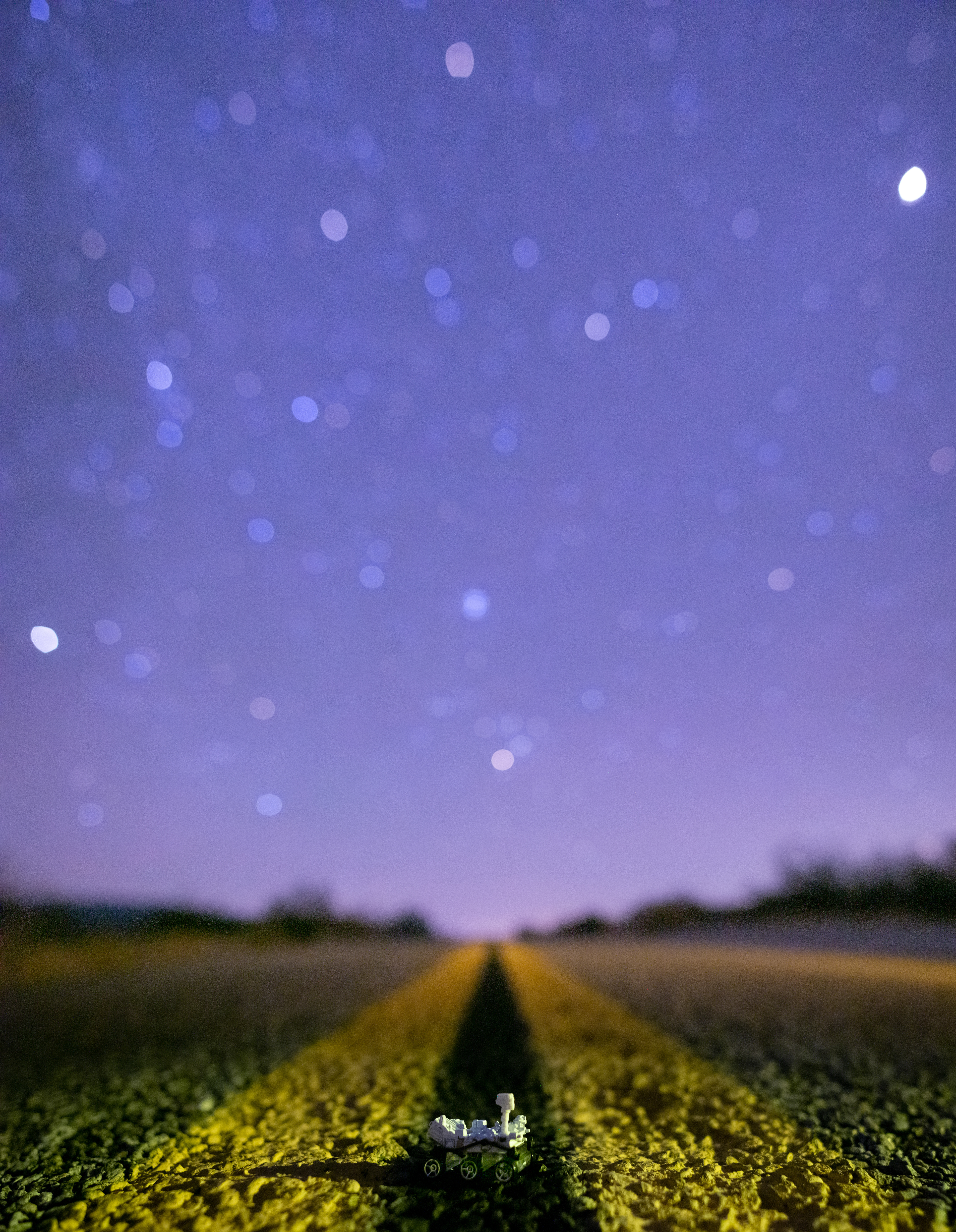 A Mars Curiosity Rover model looks to the stars in the street outside Anza Borrego State Park, CA..