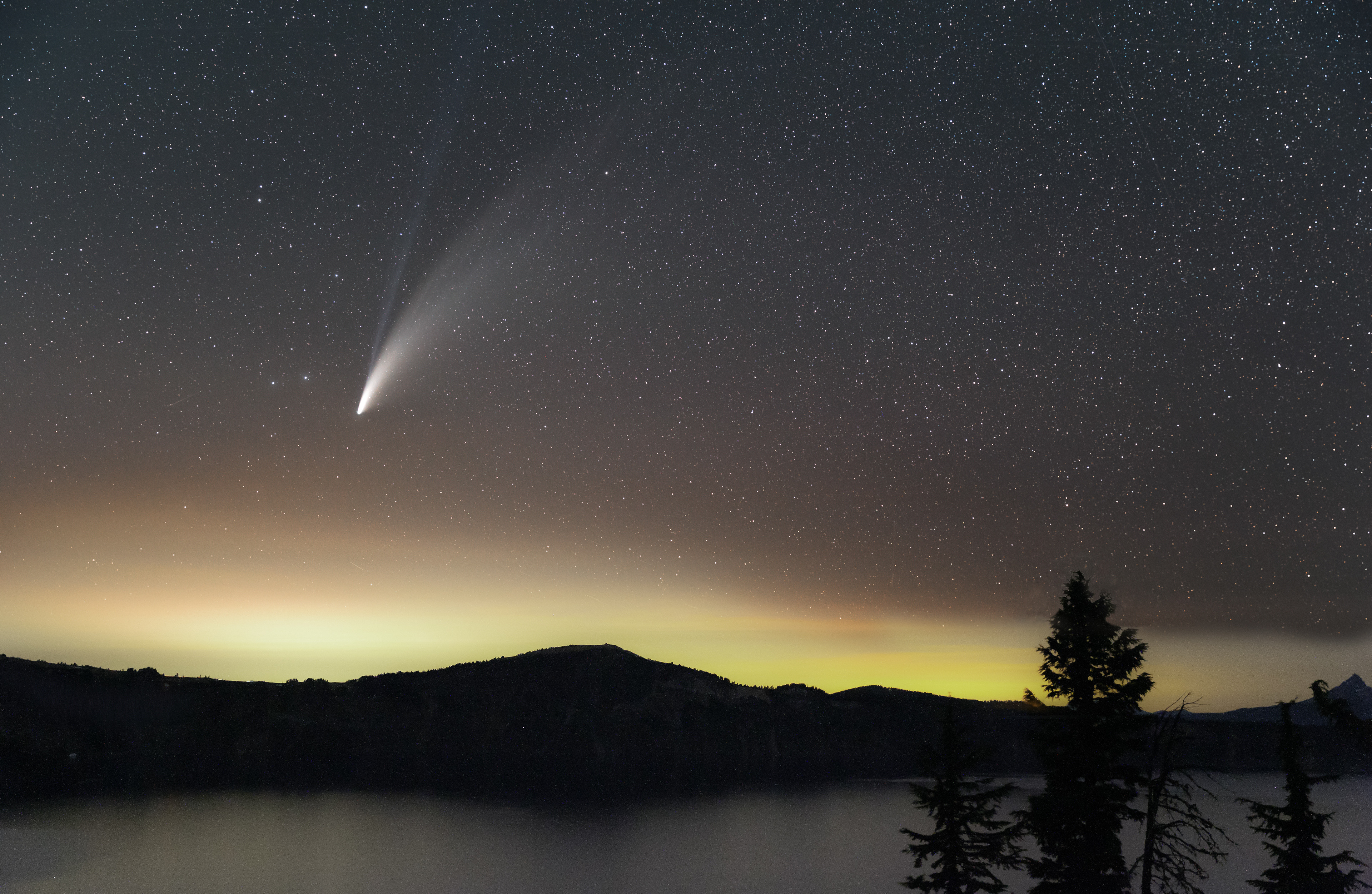 A tracked image of the comet NEOWISE provides a clearer view of its fainter ion trail, having split into two just days before this.