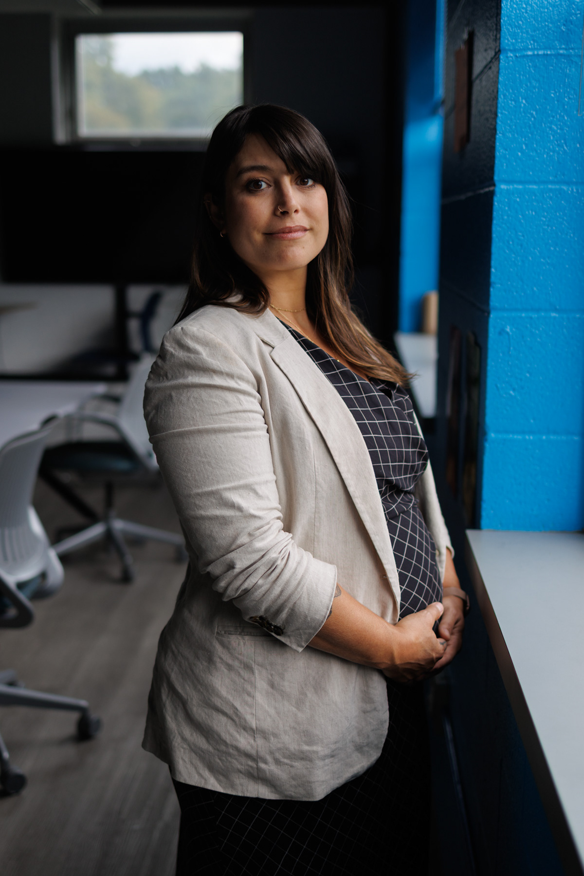 Allegheny County Executive Sara Innamorato, 40, poses for a portrait at Estelle S. Campbell Boys & Girls Club, Friday, Aug. 28, 2026, in Lawrenceville. Innamorato is backing one of the nation’s most ambitious parental leave policies which comes at a time when she is six months pregnant with her first child. (Photo by Danny Arensberg/Pittsburgh’s Public Source)